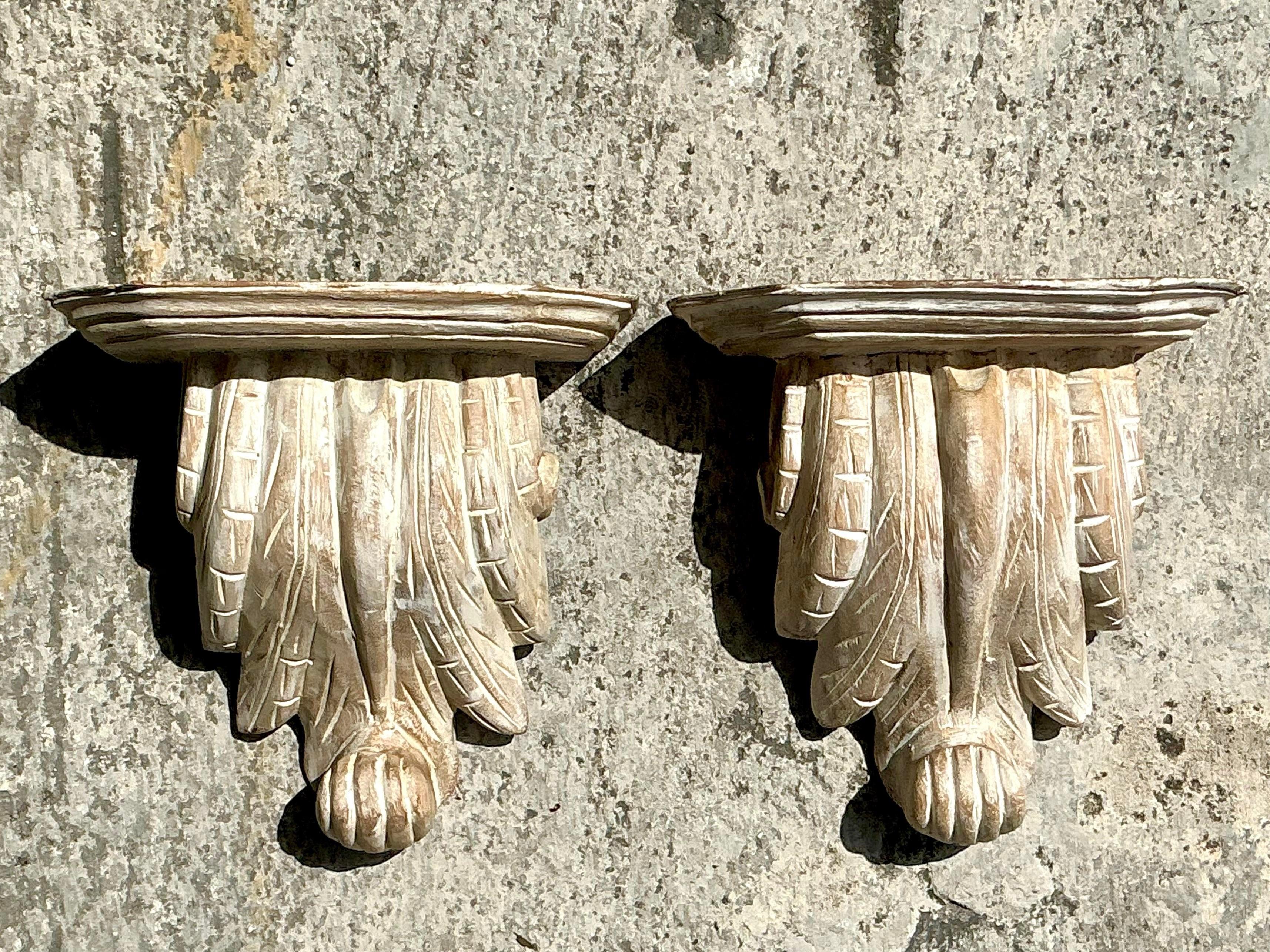 Elevate your boho-inspired decor with this pair of vintage washed wood brackets. Featuring a rustic, weathered finish, these brackets exude laid-back charm and earthy elegance. Perfect for adding support to shelves or as standalone decorative