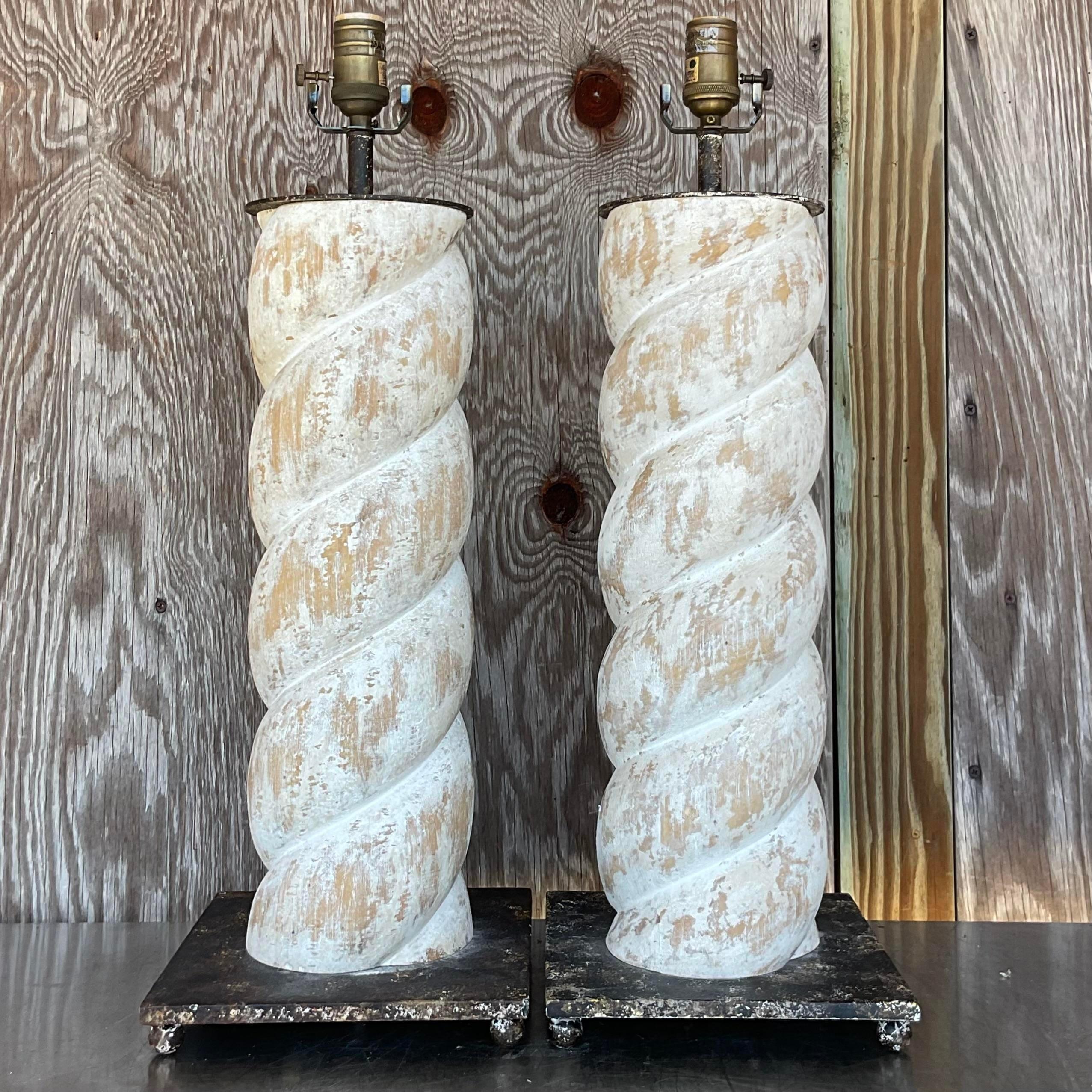 A stunning pair of vintage Boho table lamps. A chic twisted column design in wood with a whitewashed finish. Hand painted plinth and cap. Acquired from a Hobe Sound estate.