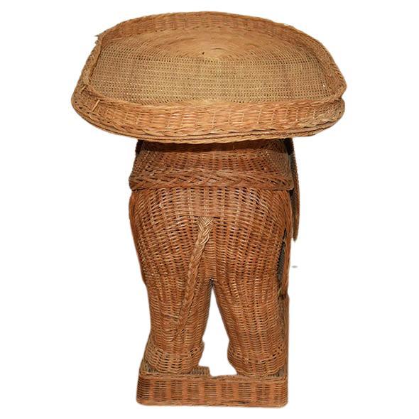 1970s Vintage Boho Figurative Animalia Wicker Rattan elephant side tray table in the style of Mario Lopez Torres. This Animalia vintage 1960s-1970s Italian woven wicker elephant occasional table/garden stool or side table is in wonderful condition,