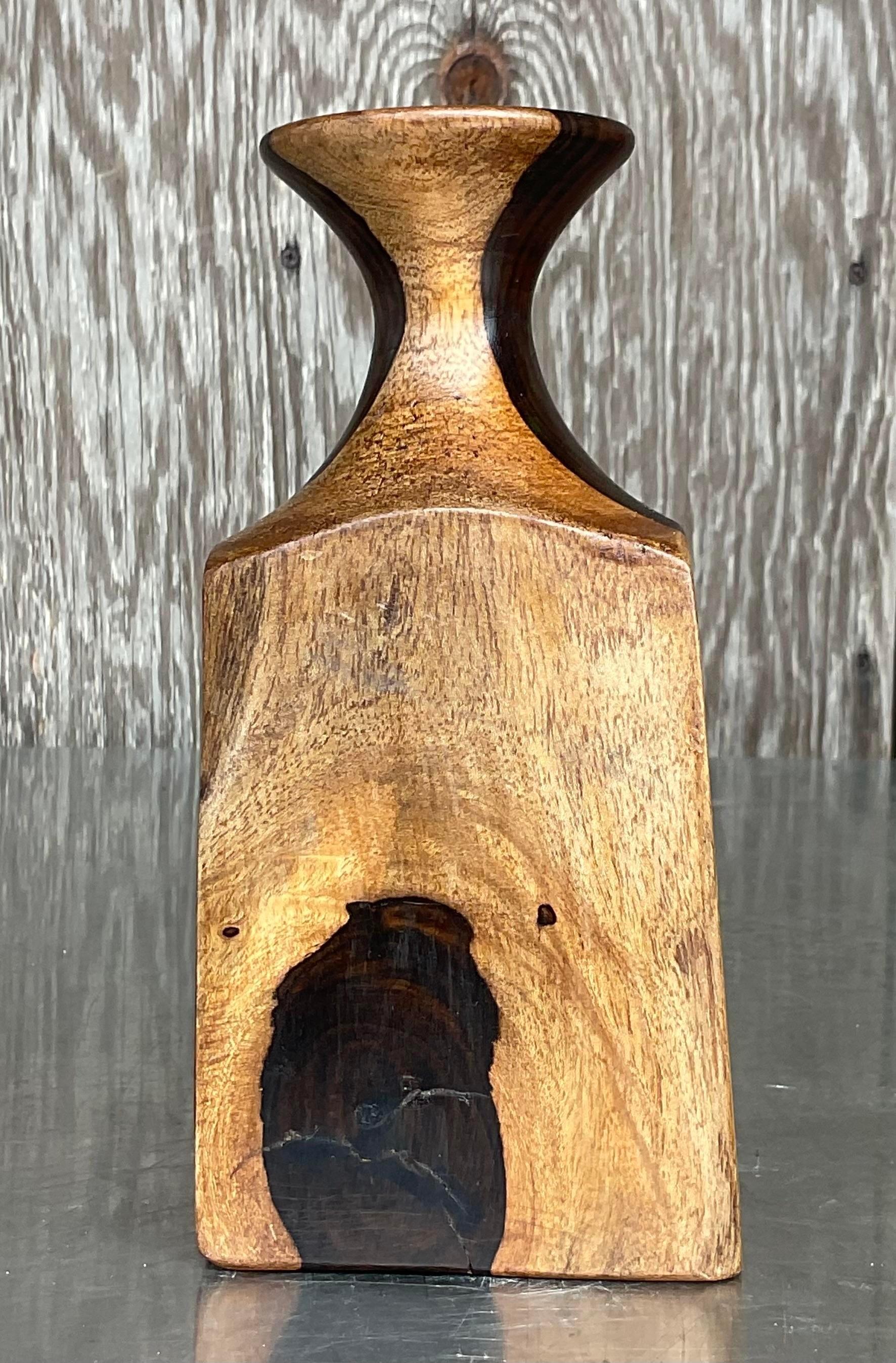 A fantastic vintage boho carved vase. A chic organic design with flowing lines and beautiful wood grain detail. Acquired from a Palm Beach estate. 
