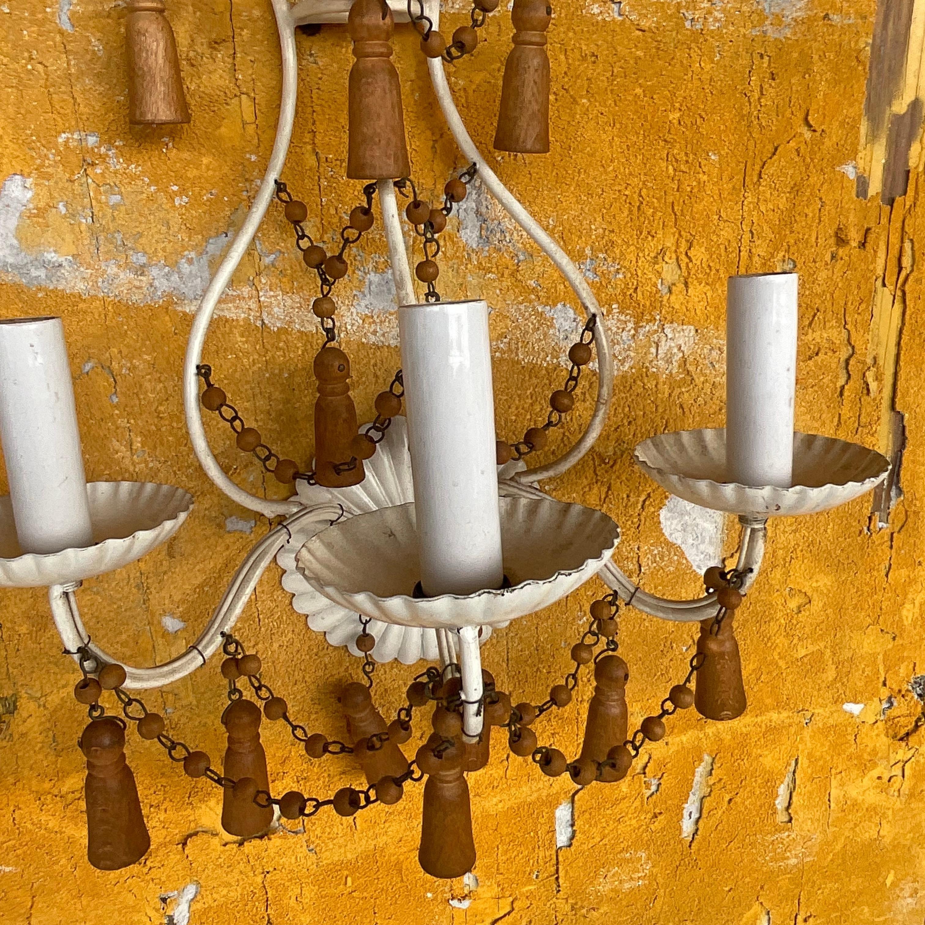 Illuminate your space with the rustic elegance of our Vintage Boho Wooden Swag Light Sconces - A Pair. Inspired by the natural beauty of American landscapes, these handcrafted sconces exude timeless charm and Bohemian allure. Enhance any room with
