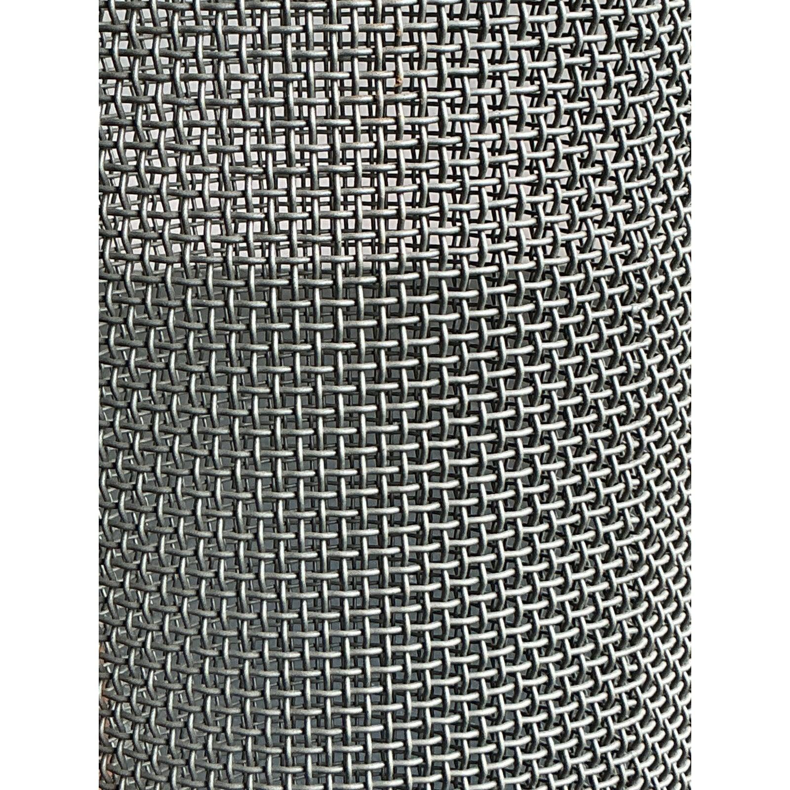 Elevate your interior with this striking vintage Boho Woven Metal Pedestal, a testament to industrial craftsmanship with a bohemian twist. Crafted from finely woven metal, this piece forms a unique cylindrical shape, offering a translucent yet