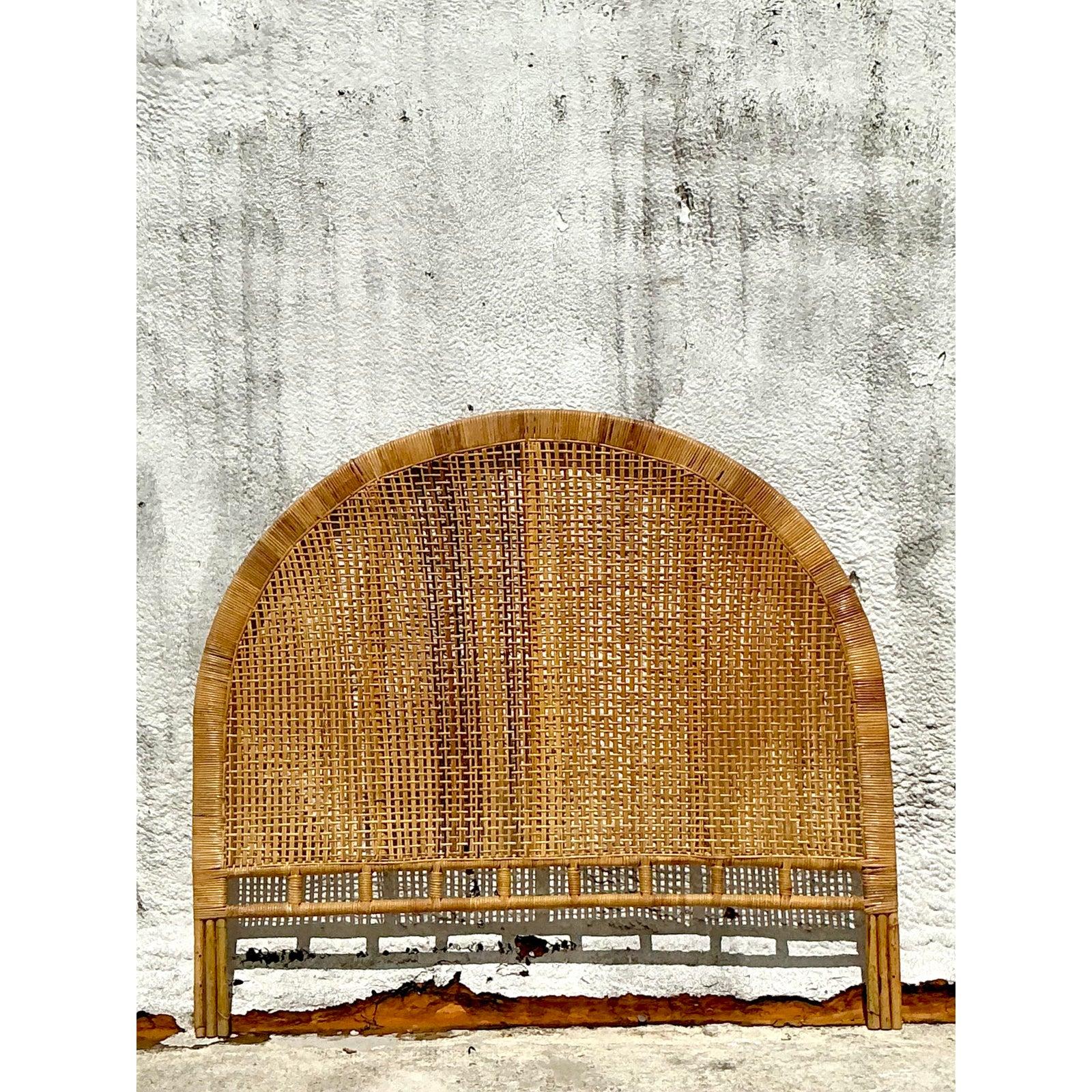 Transform your bedroom into a serene, bohemian oasis with this beautiful vintage woven rattan queen headboard. Its elegant arched silhouette and intricate, airy weave showcase the natural beauty and artisanal craftsmanship of rattan, bringing an