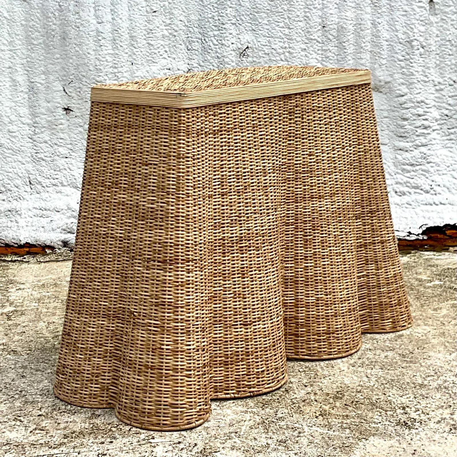 Incredible vintage coastal woven rattan console table. The coveted Ruffle edge design in a pale rattan color. Acquired from a Palm Beach estate.