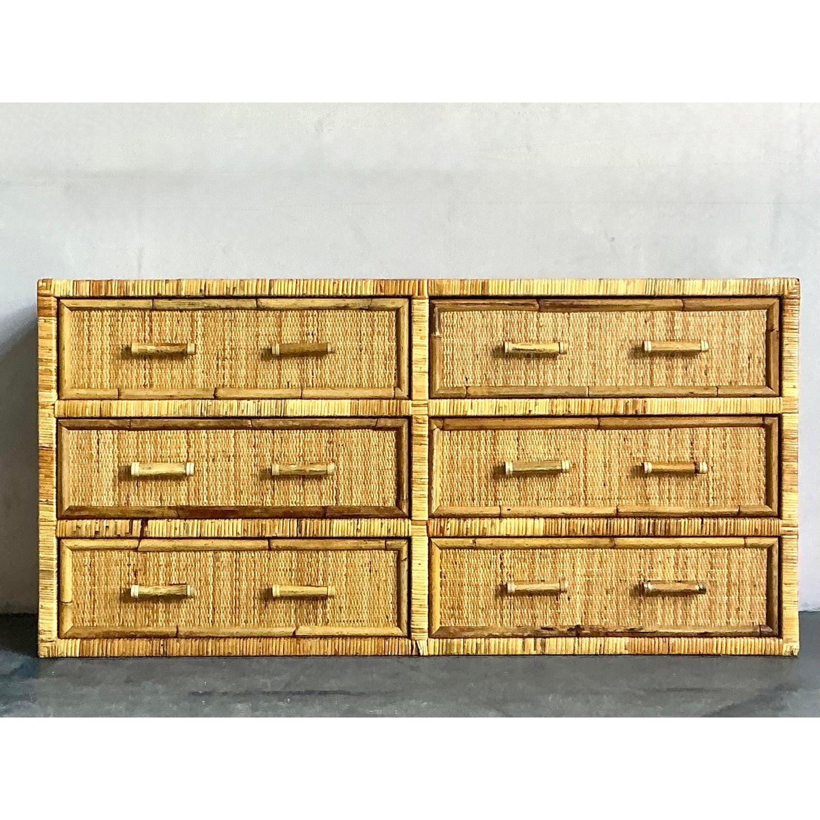 This charming vintage six-drawer dresser exudes a delightful Boho aesthetic, meticulously crafted from woven rattan and bamboo. Its natural textures and warm hues bring an inviting, organic feel to any space, while the clean lines give it a