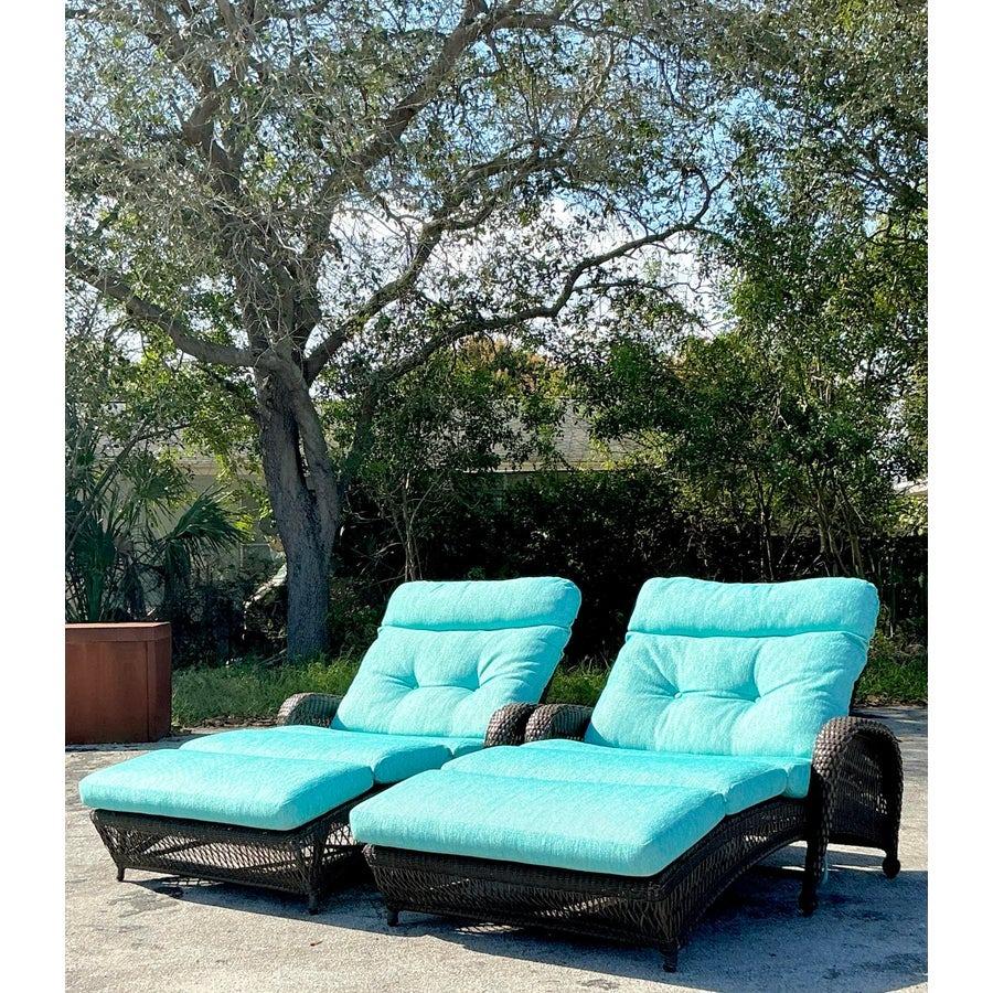 Relax in style with this set of two vintage boho woven resin rattan lounge chairs. Featuring a sturdy woven rattan frame with a rich brown finish and vibrant turquoise cushions, these chairs offer the perfect combination of durability and comfort.