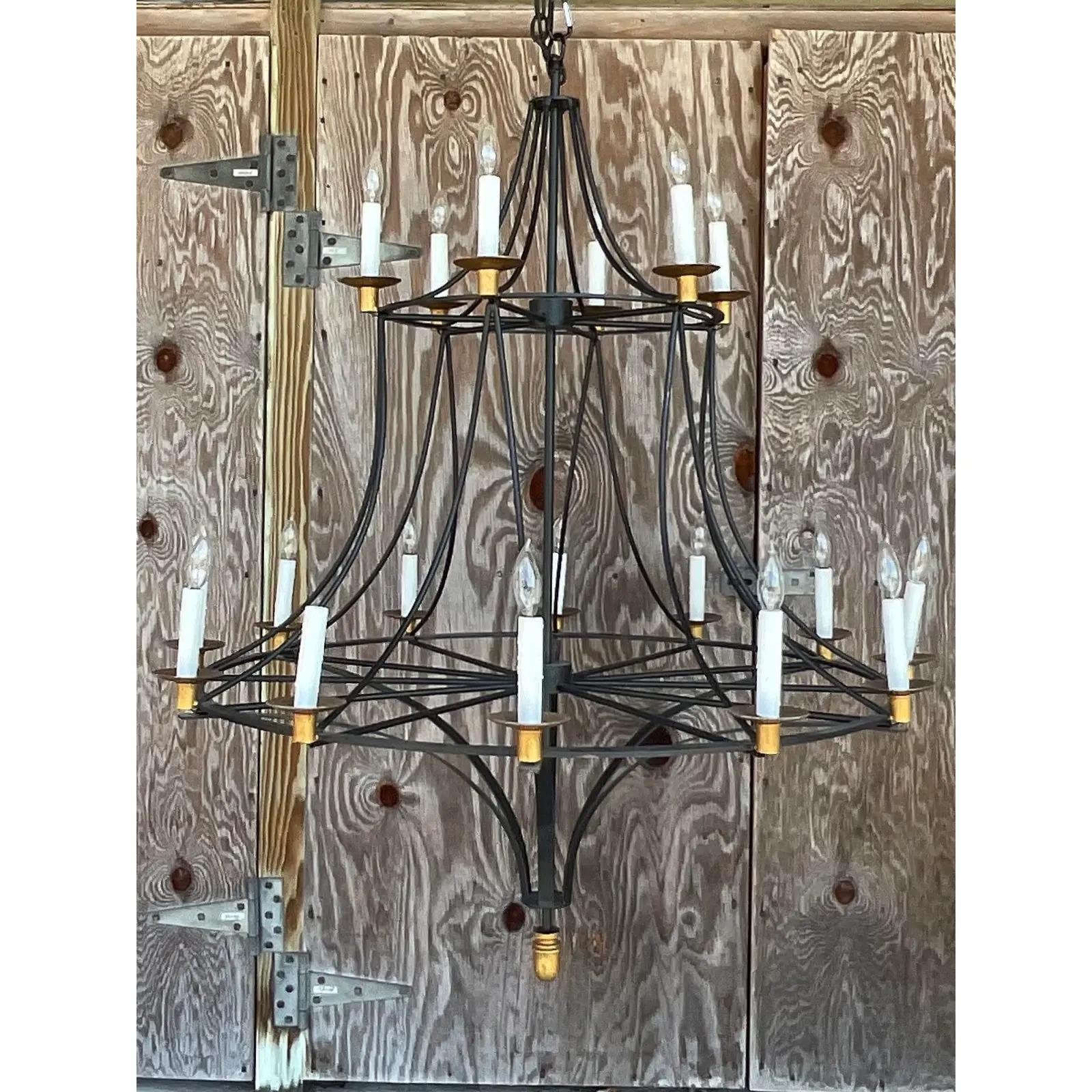 Fantastic vintage Boho chandelier. Monumental in size and drama. Black wrought iron with gilt touches. Acquired from a Boca estate.