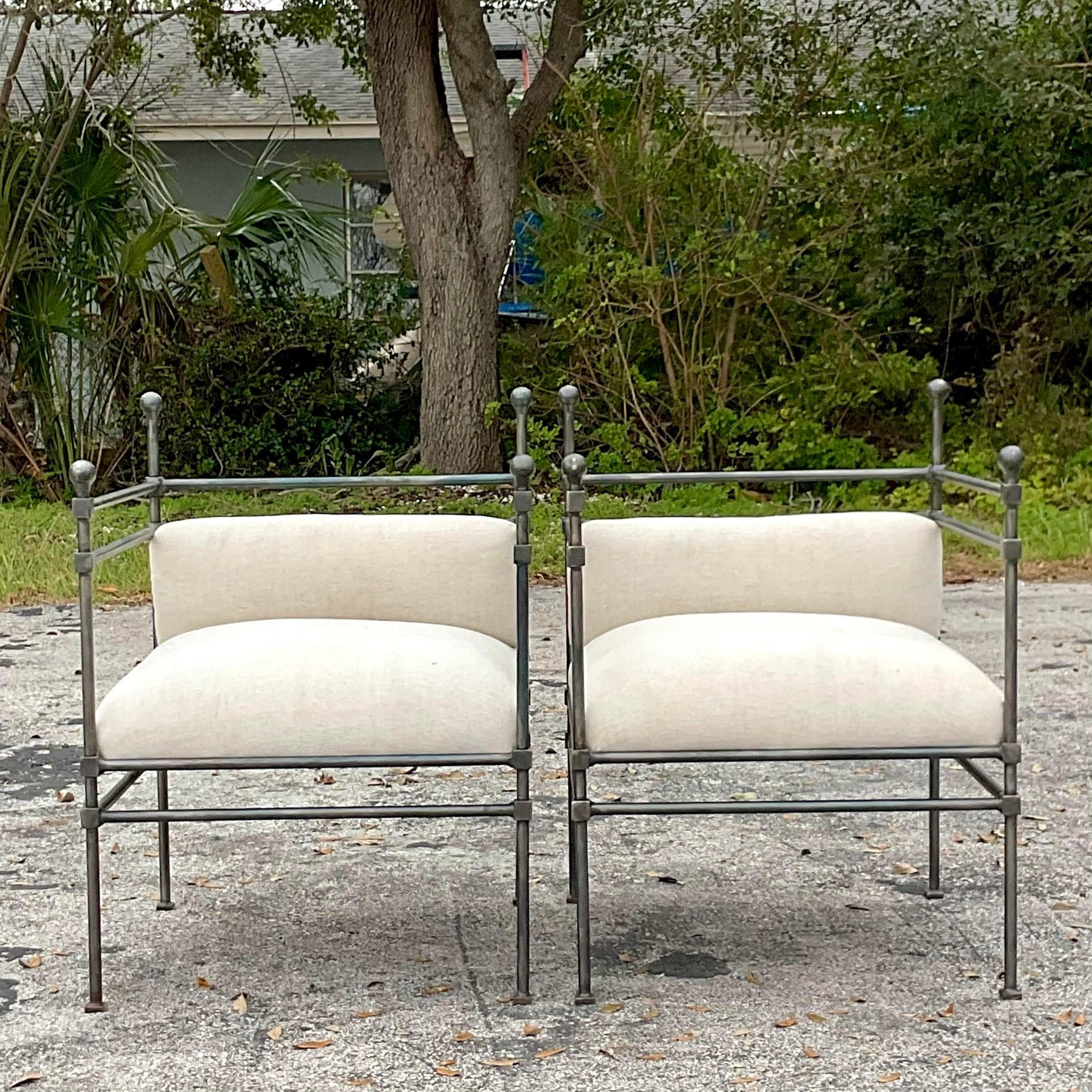 A stunning pair of vintage Boho lounge chairs. The chic Burnham style in wrought iron and hand woven linen upholstery. Acquired from a Palm Beach estate. 