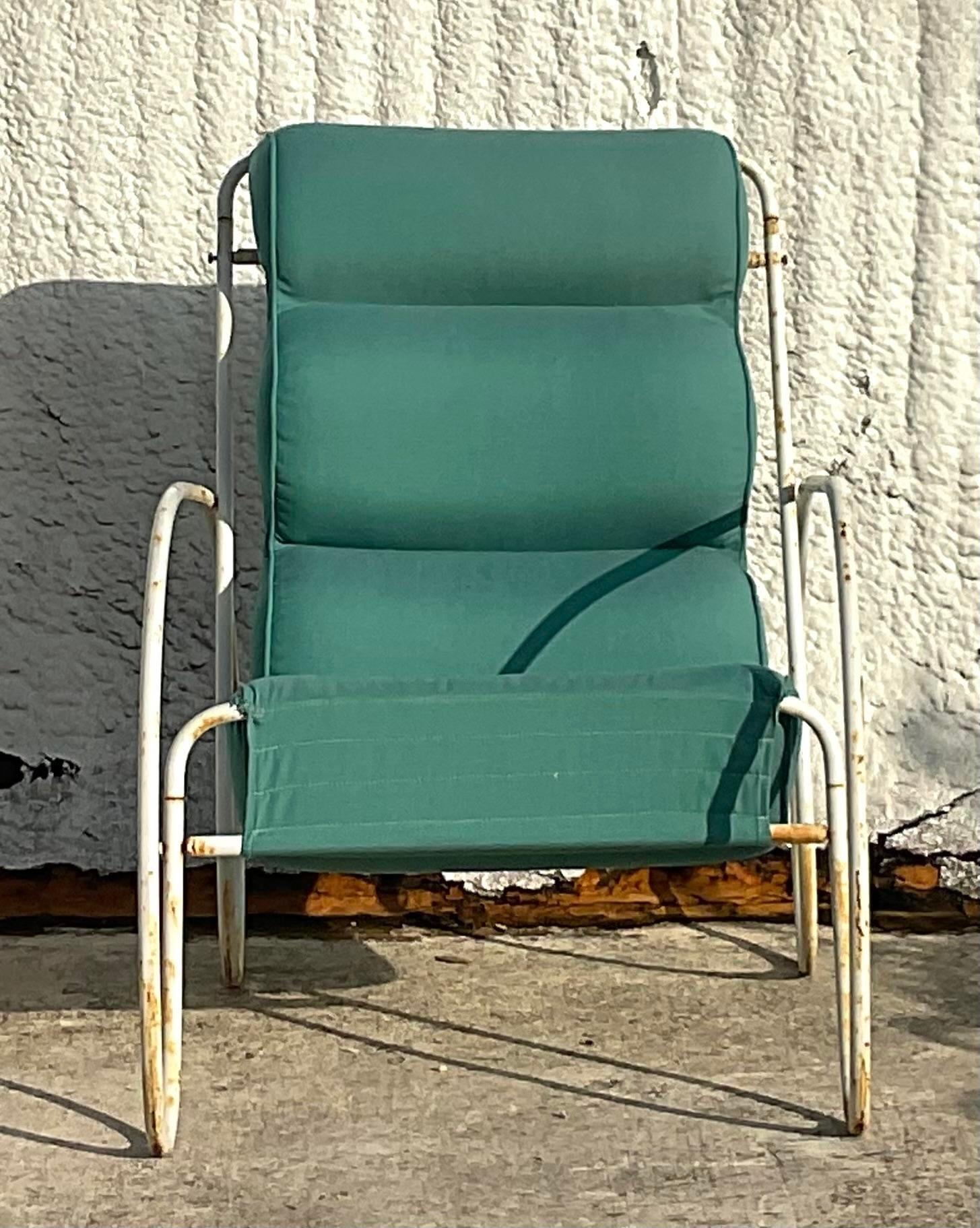An exceptional vintage Boho outdoor lounge chairs. Done in the manner of Eileen Gray. A whimsical wrought iron frame with a channel tufted cushion. Perfect indoors our out. You decide! Acquired from a Palm Beach estate.

Seat height 15 