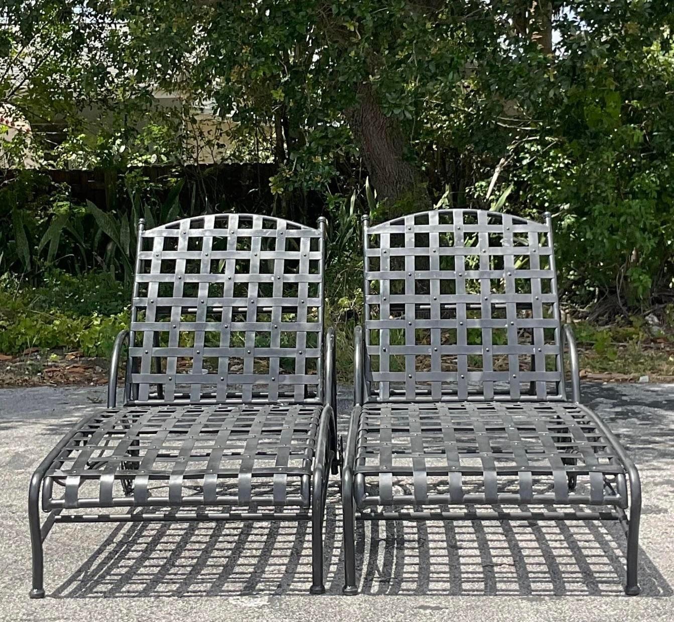 Relax in style with this pair of vintage Boho wrought iron chaise lounge chairs. Blending Bohemian flair with American craftsmanship, these chairs offer both comfort and character, making them a standout addition to any outdoor or indoor setting. 