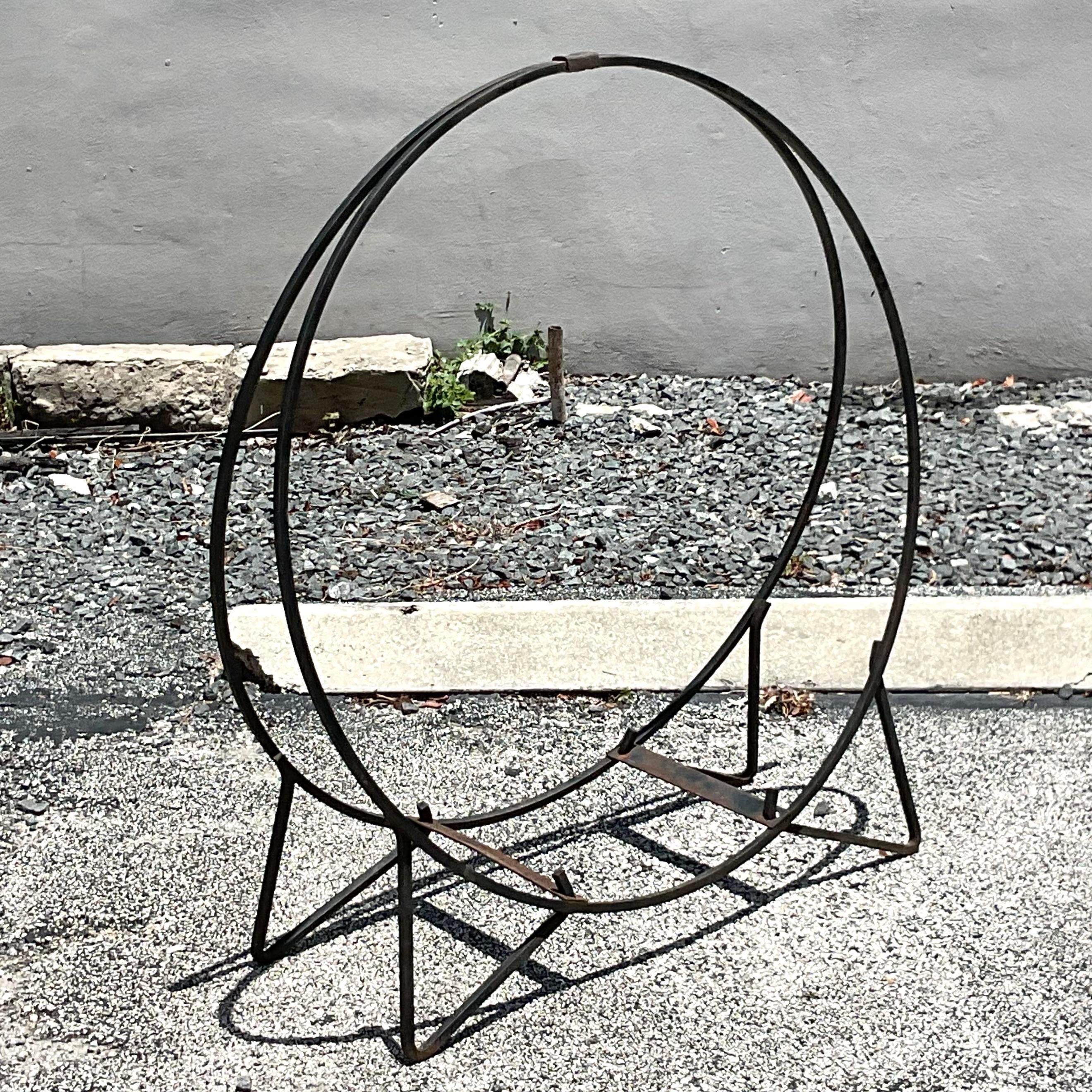 A fabulous vintage Boho firewood holder. A chic monumental design in wrought iron. Perfect indoors or outside. You decide! Acquired from a Westport estate. 