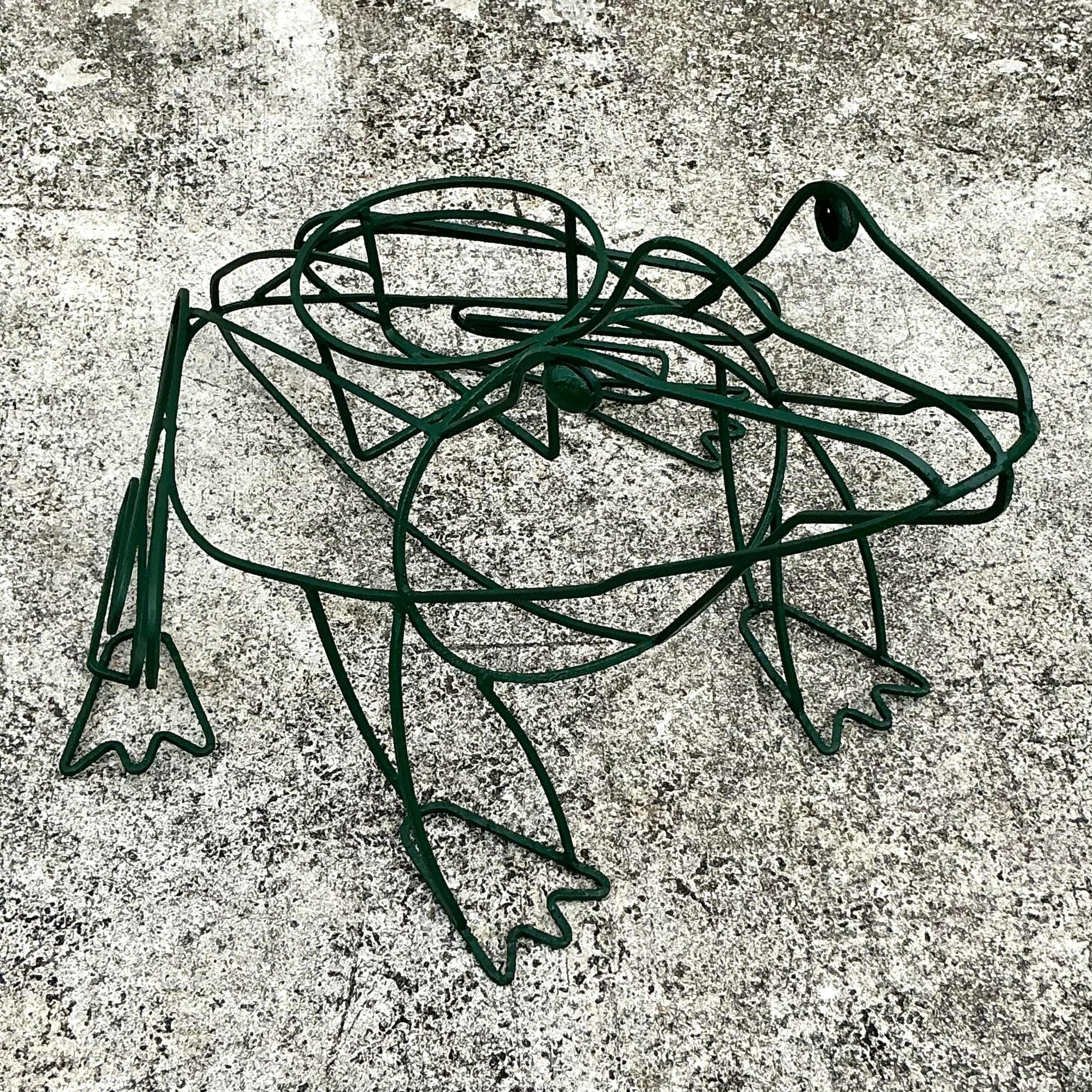 Add a touch of whimsy to your garden or home with this Vintage Boho Wrought Iron Frog Planter. Expertly crafted with charming details, the playful frog design adds character and a bohemian flair to your plant displays. Sturdy yet artistic, this