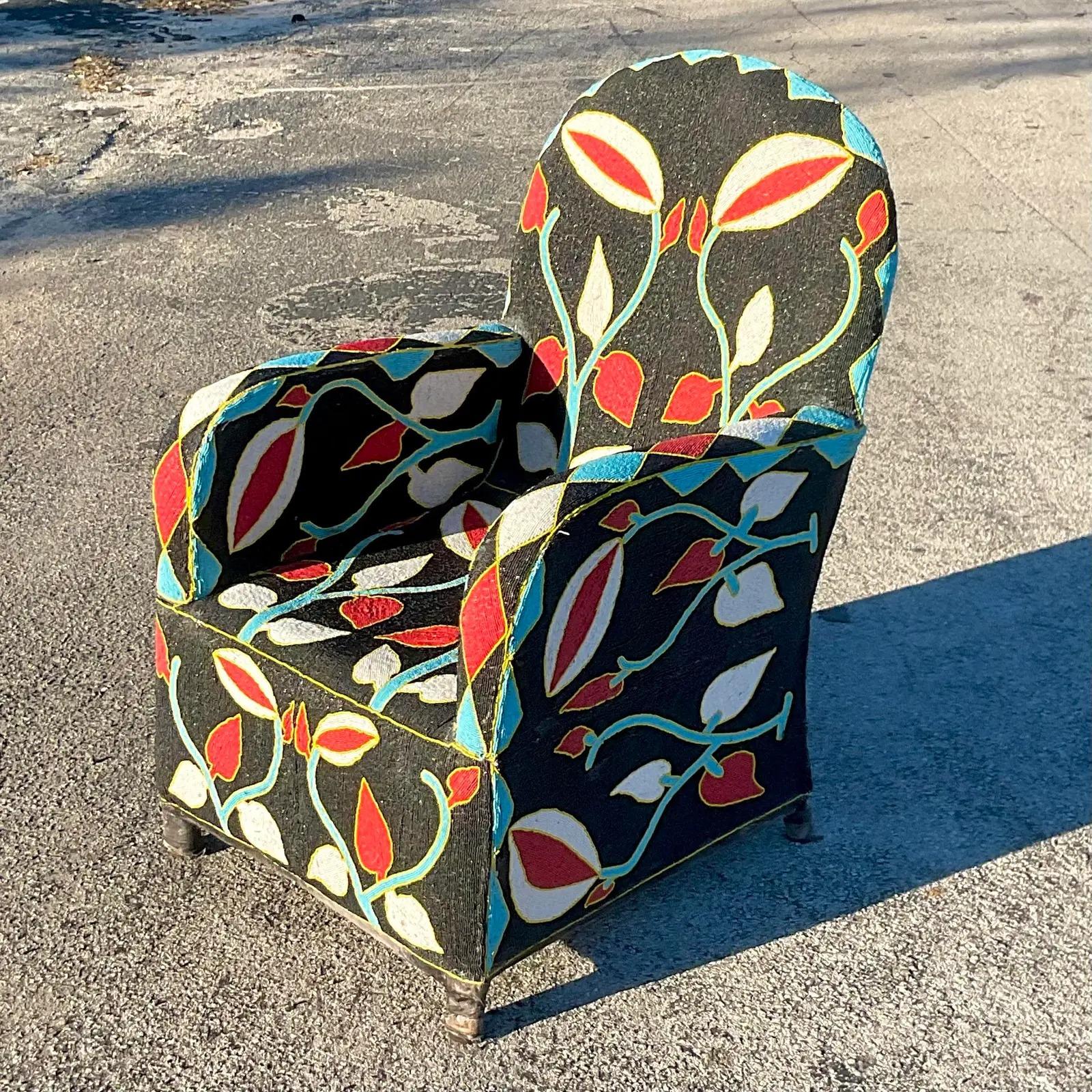 A spectacular vintage Boho arm chair. A chic Yoruba style in a brilliant colorful design. Completely hand beaded with incredible attention to detail. Acquired from a Palm Beach estate.