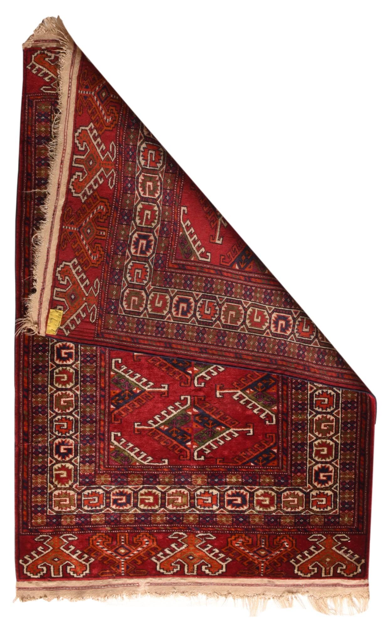 Vintage Bokhara rug¬†2'9'' x 4'1''. This all-wool construction authentic tribal Yomud scatter shows a central column of hooked Dyrnak lozenge guls with half guls at the sides on a red-brown ground. curled leaf border. Wide red-brown elems' (extra