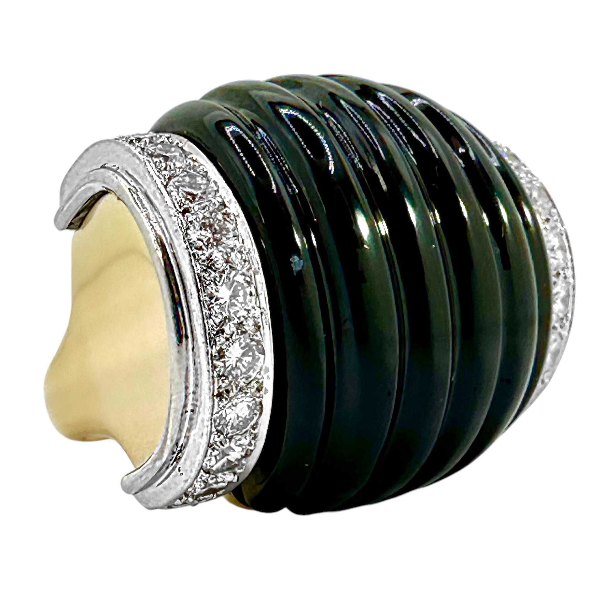 This big and bold creation by designer Charles Turi is pure 1970's in design. A large center bombe section of fluted black onyx is bracketed by two lines of diamonds set in platinum plates. A total of  twenty four round modern brilliant cut diamonds