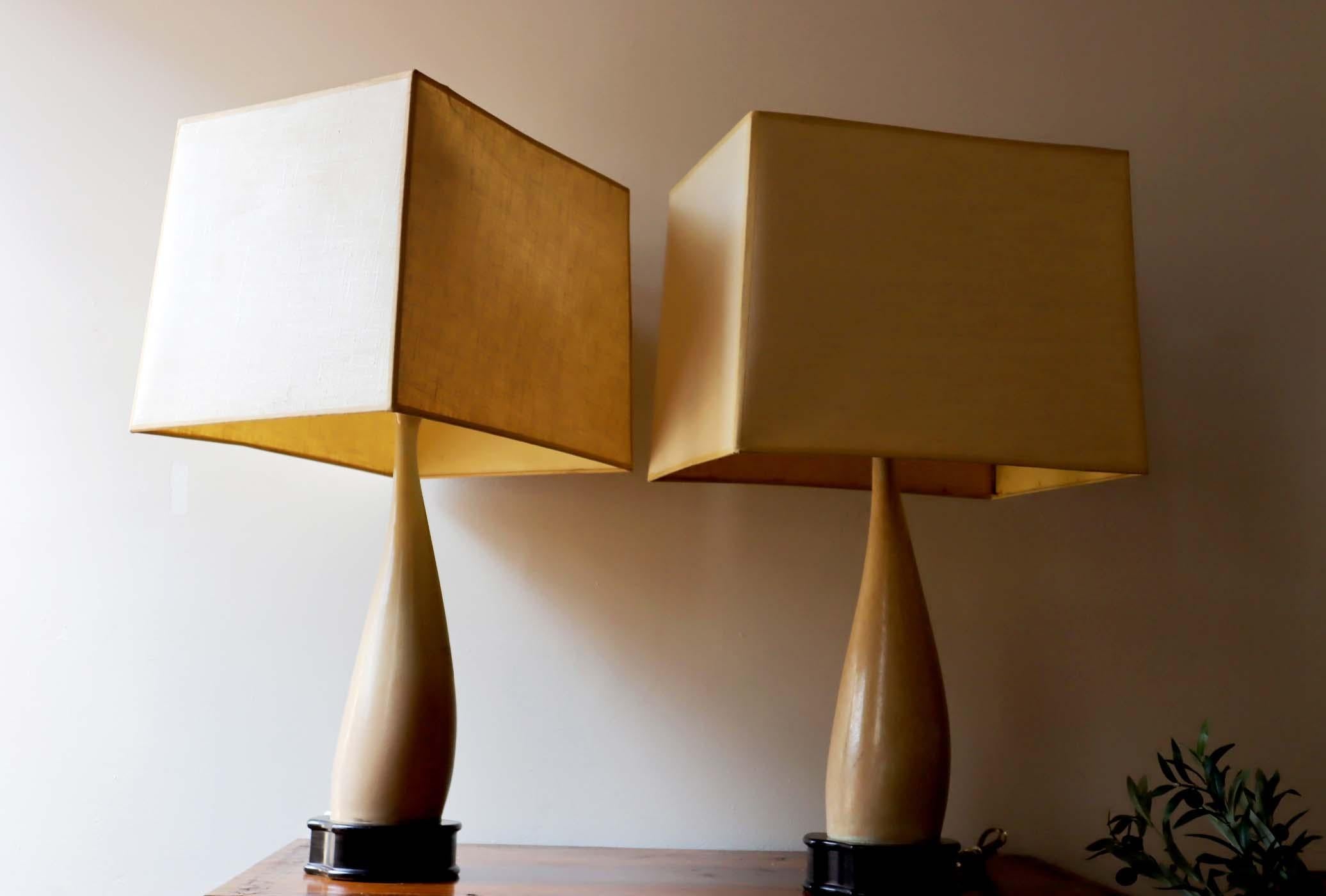 Pair of vintage lamps crafted from bone.
Please note there is wear from age on lamp shades.