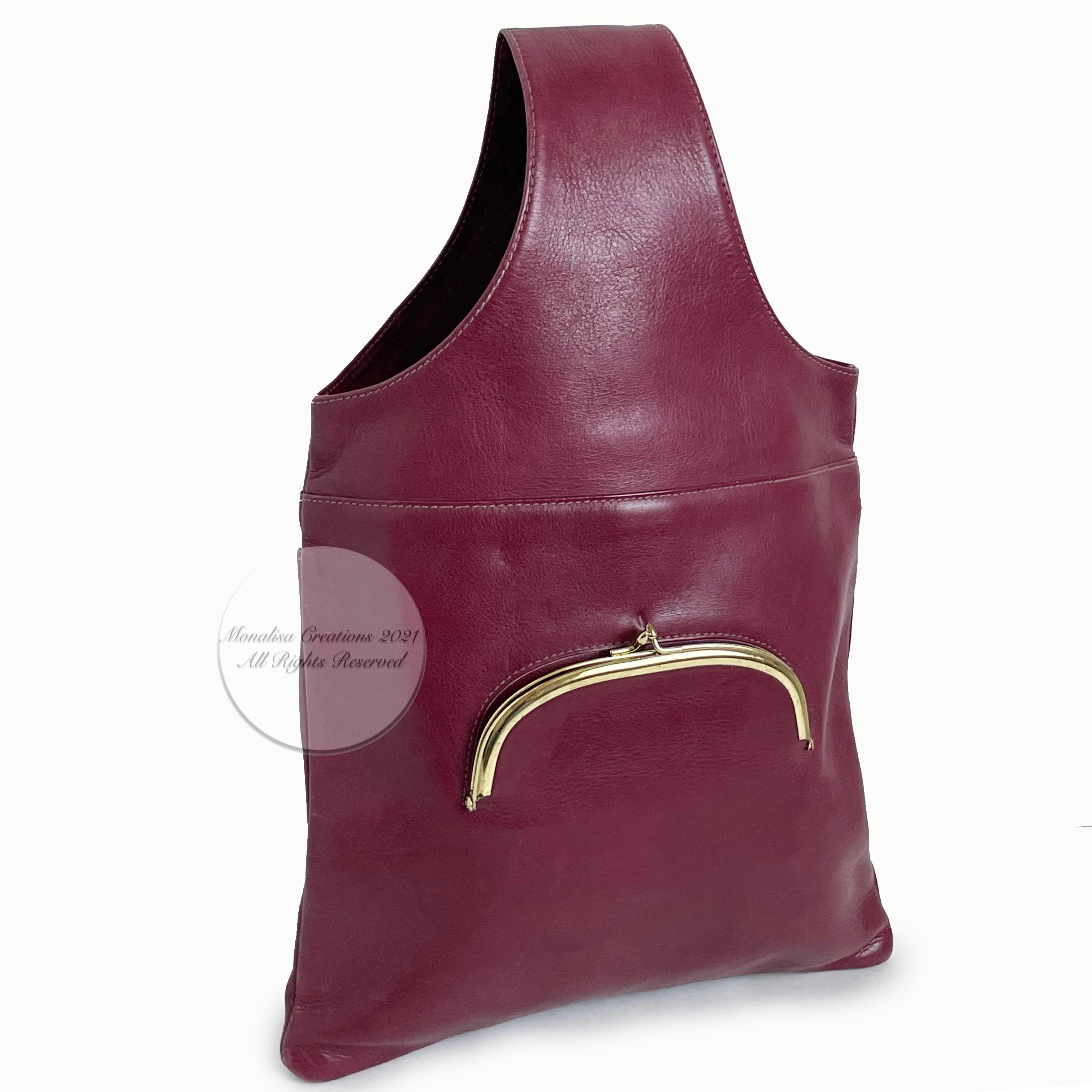 Authentic, preowned, vintage and EXTREMELY rare Bonnie Cashin for Meyers burgundy leather sling bag tote, circa the mid 70s.  A must-have for the collector, and so hard to find nowadays, especially in this condition. Made from rich burgundy leather,