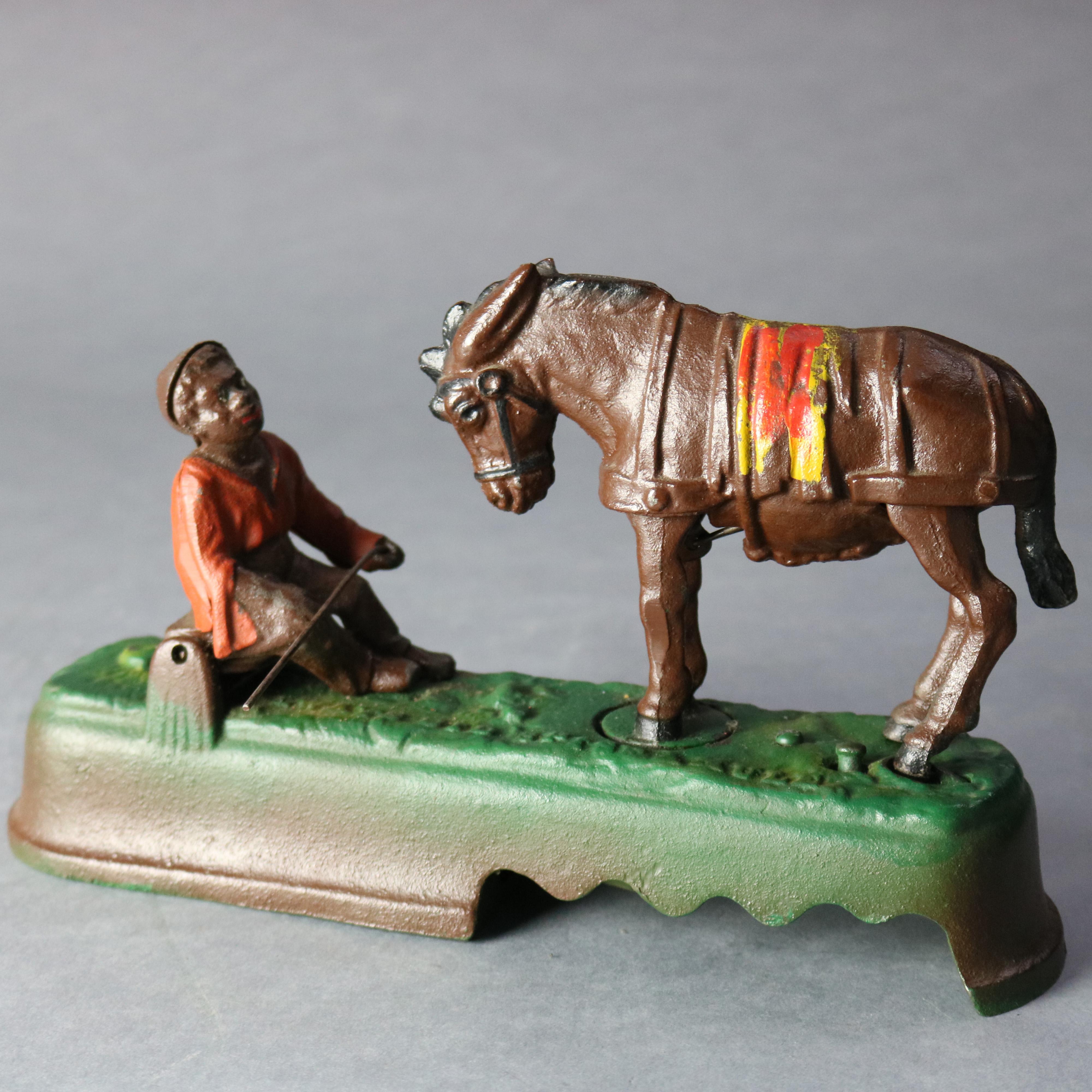American Vintage Book of Knowledge Cast Iron Spise a Mule Mechanical Bank, 20th Century