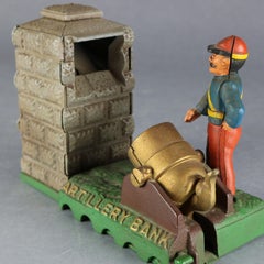 Vintage Book of Knowledge Cast Iron Mechanical Artillery Bank, circa 1960