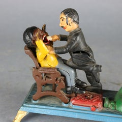 Vintage Book of Knowledge Cast Iron Mechanical Bank, The Dentist, 20th Century