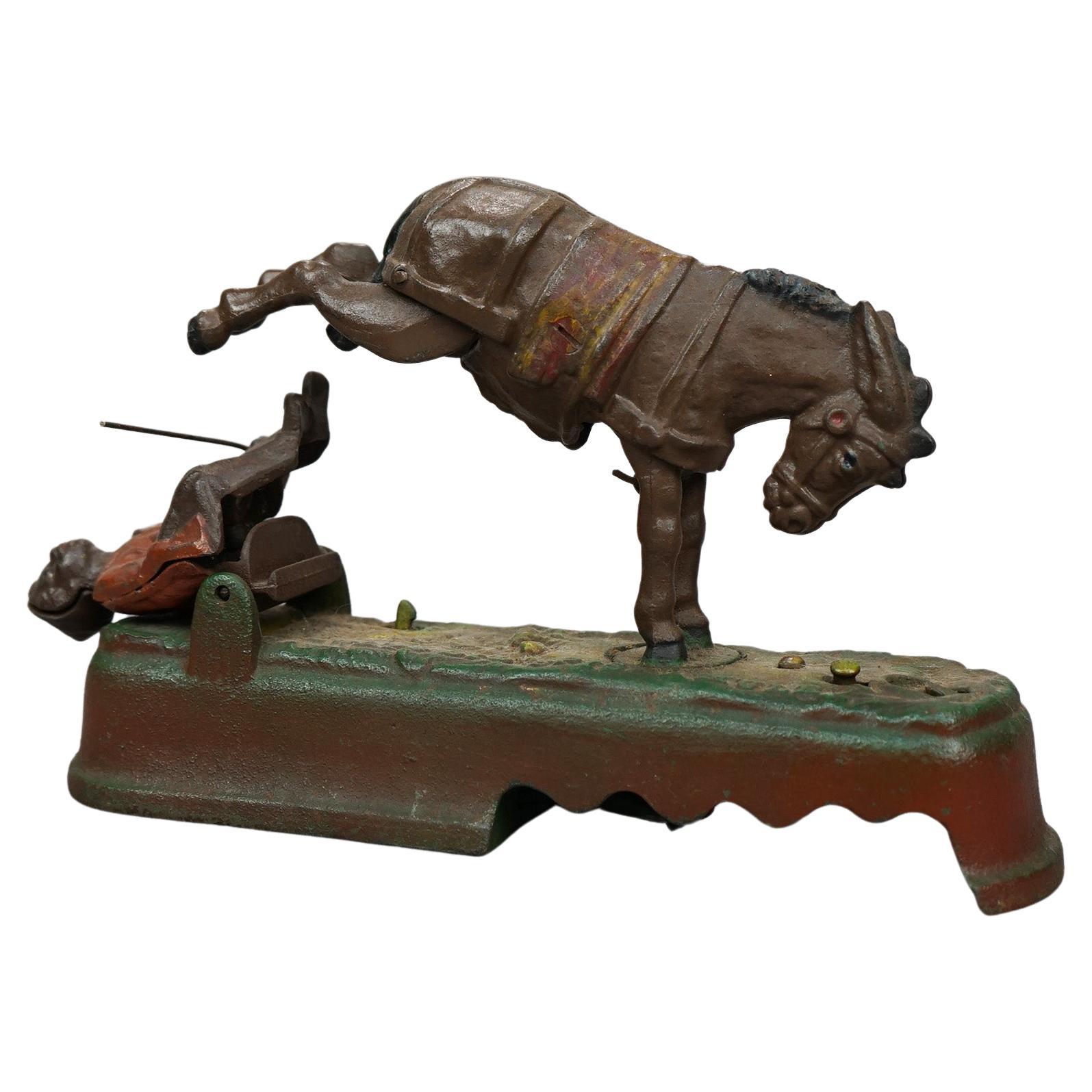 Vintage Book of Knowledge Cast Iron 'Spise a Mule Mechanical Bank, 20th Century