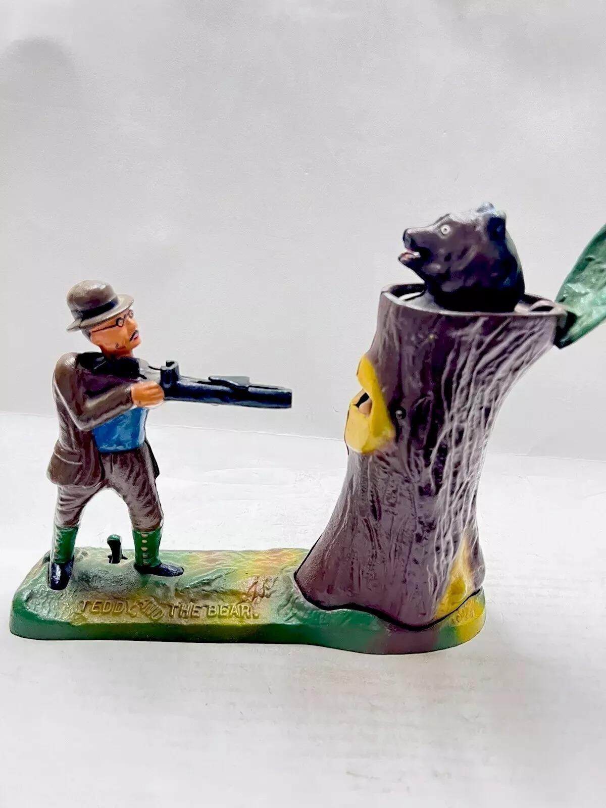 Vintage Book Of Knowledge Cast Iron Still Bank Teddy and the Bear Coin Bank. Circa Late 20th Century. Measurements: 7.5