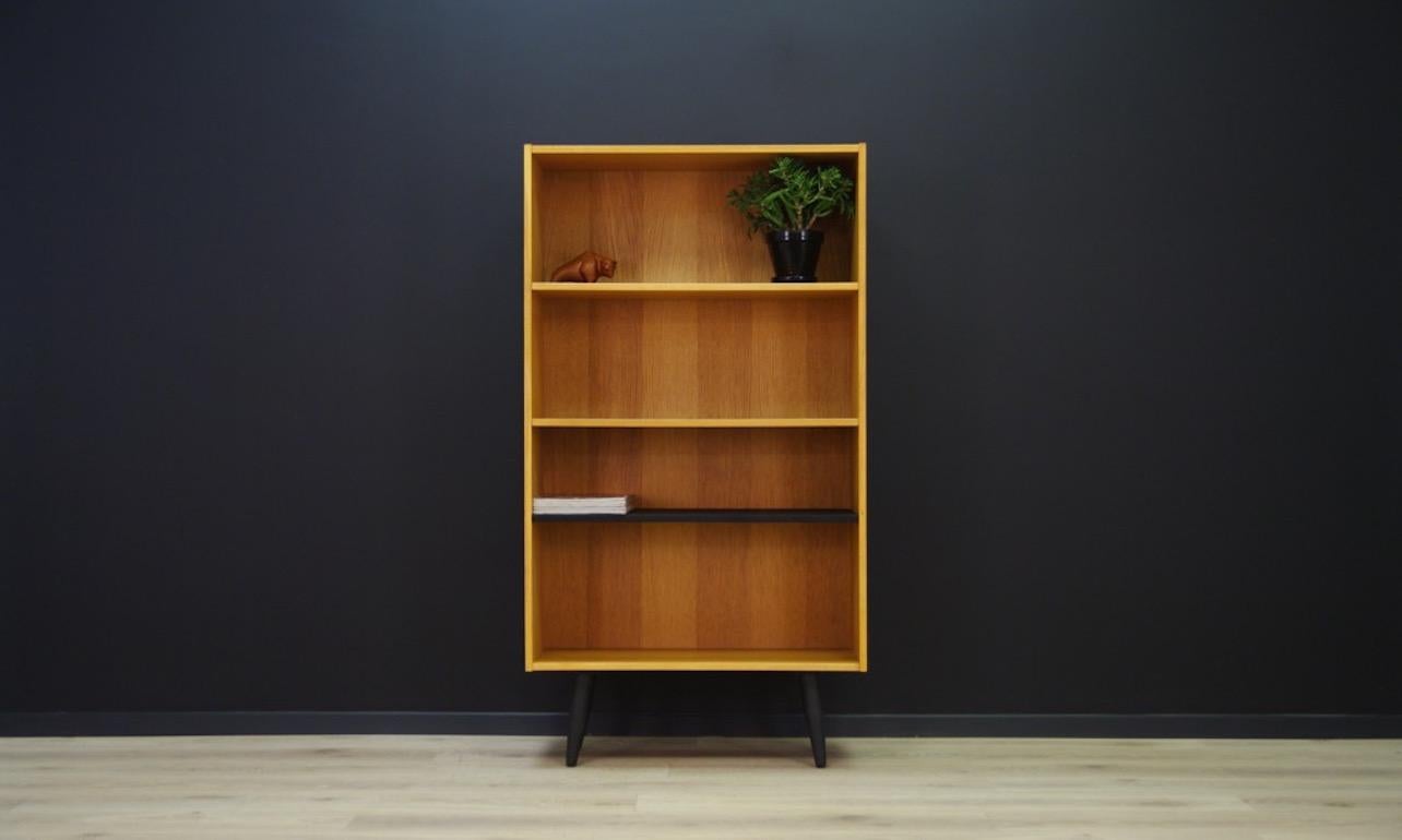 Bookcase from the 1960s-1970s, Minimalist form. Bookcase finished with ash veneer. The lowest shelf colored in black. Preserved in good condition (minor scratches) directly for use.

Dimensions: height 146.5 cm width 80 cm depth 32 cm.