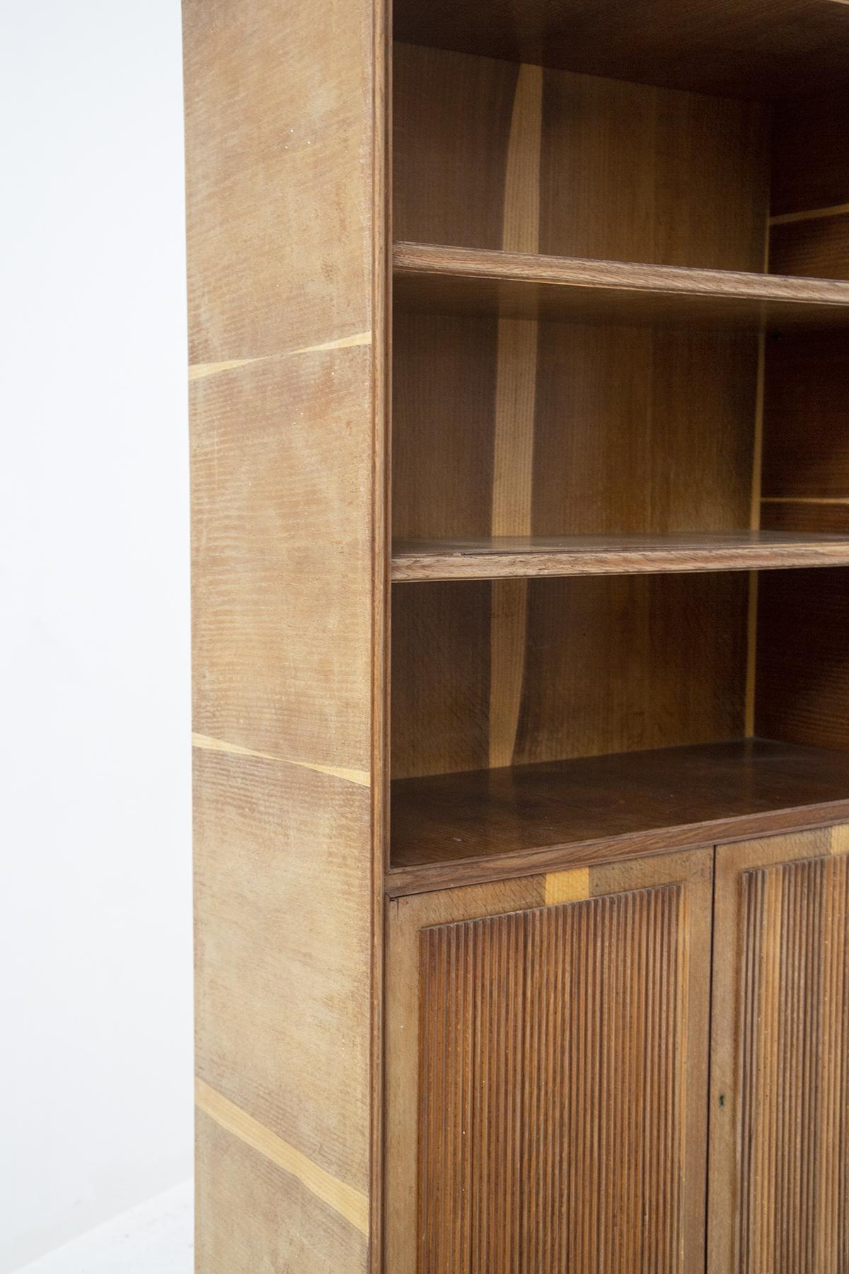 Wonderful wooden bookcase cabinet designed by Paolo Buffa in the 50's, fine Italian manufacture. Provenance is from the house on Lake Como.
The structure is totally made of bleached walnut wood, with grissinata workmanship.
The supporting feet are