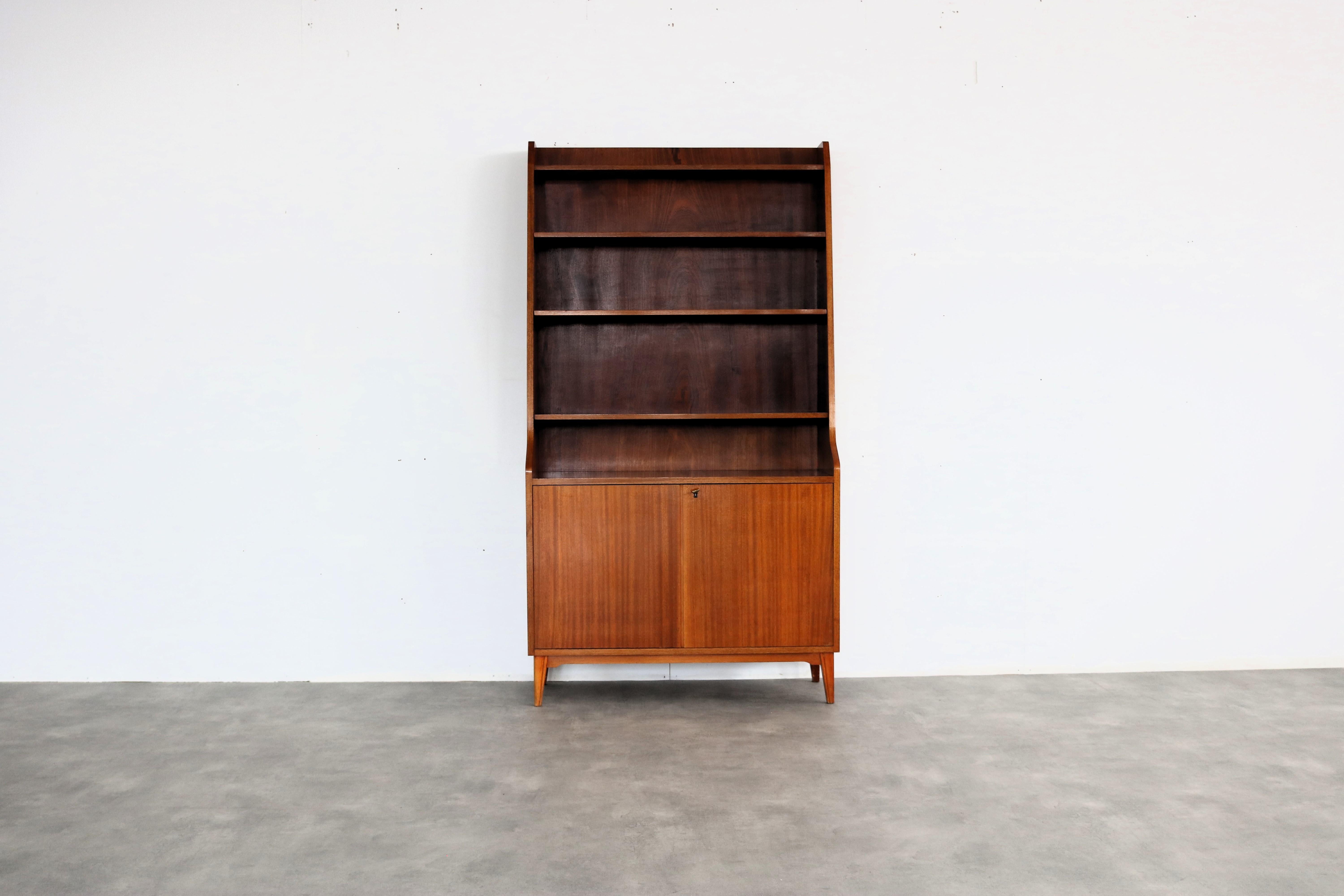 vintage bookcase | cupboard | 60s | Sweden

period | 60's
design | unknown | Sweden
condition | good | slight signs of use/colour difference
size | 175 x 95 x 37 (hxwxd)

details | teak;

article number | 2239