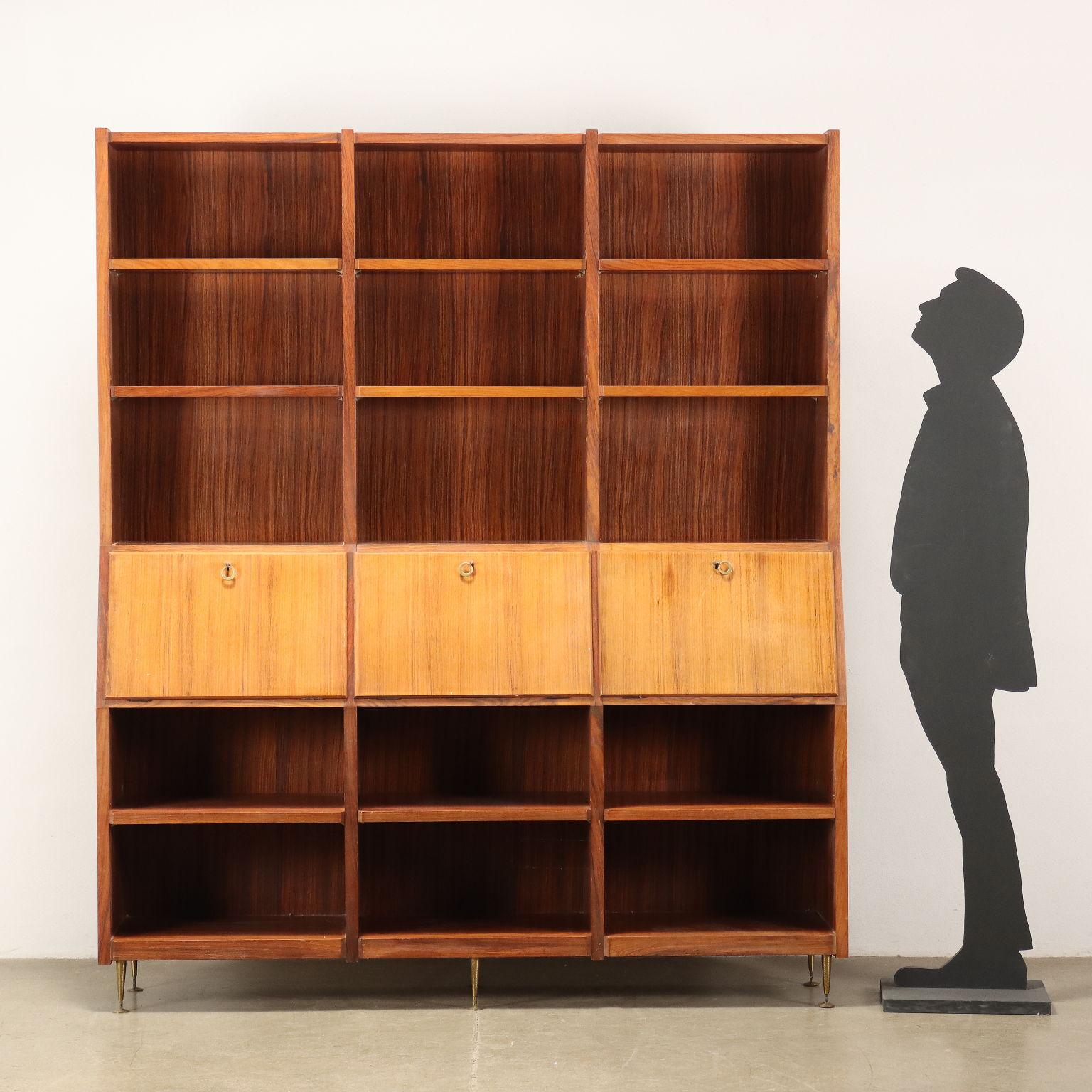 Bookcase with flap compartments in exotic wood veneer with brass legs.