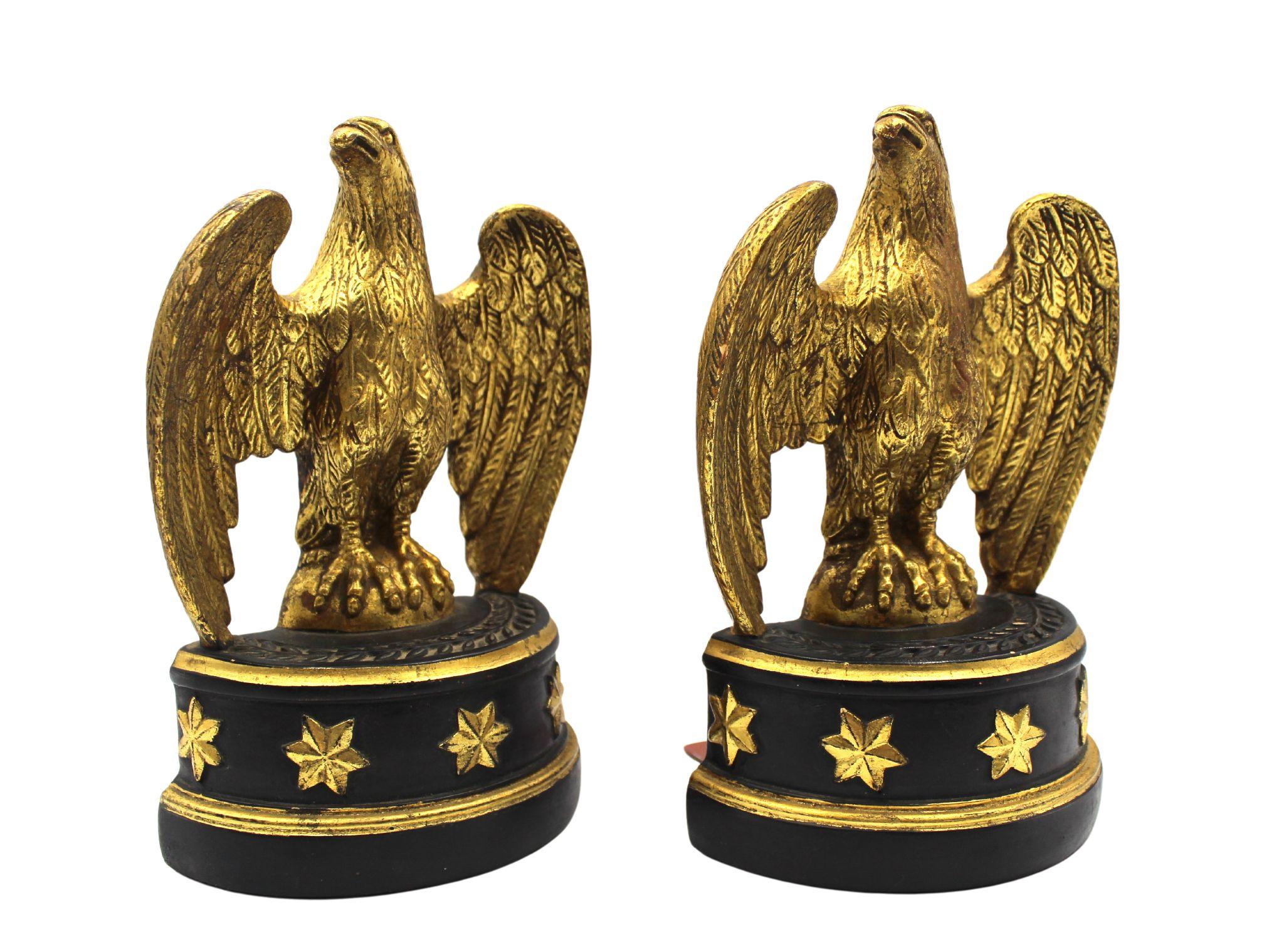 Presented is a pair of vintage plaster cast American Eagle bookends. The bookends were designed by Borghese of Italy, in a Federal style, with a black base and five gold stars. This beautiful bookend pair is the same style as seen in photos of John