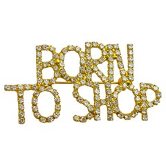 Vintage BORN TO SHOP gold tone rhinestones designer brooch