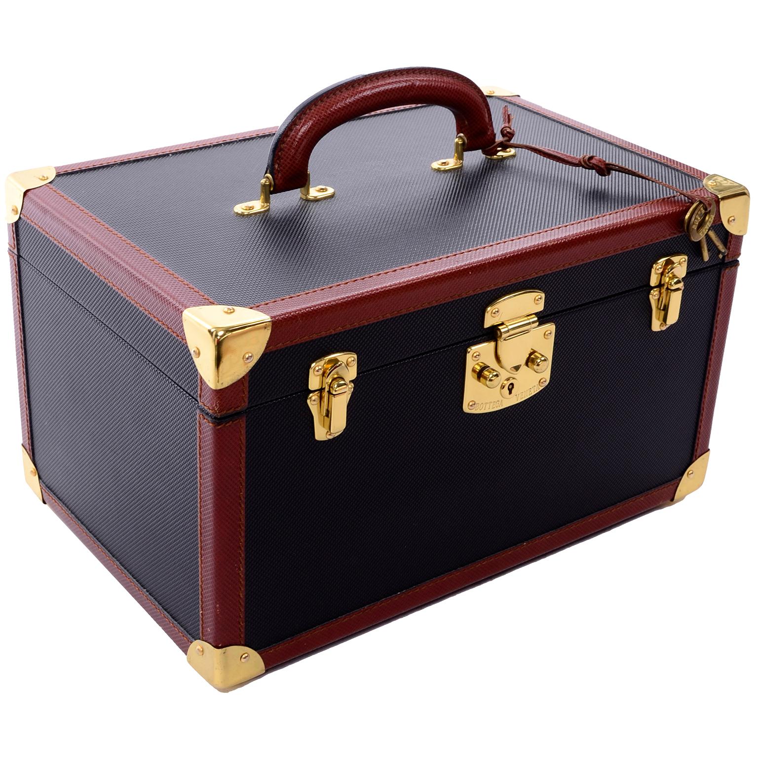 This is a wonderful, timeless Bottega Veneta vintage Train case that comes with its original dust bag and two keys. The inside of the case has a loose box with a roll back top and quilted bottom. Inside is lined with clear plastic for protection and