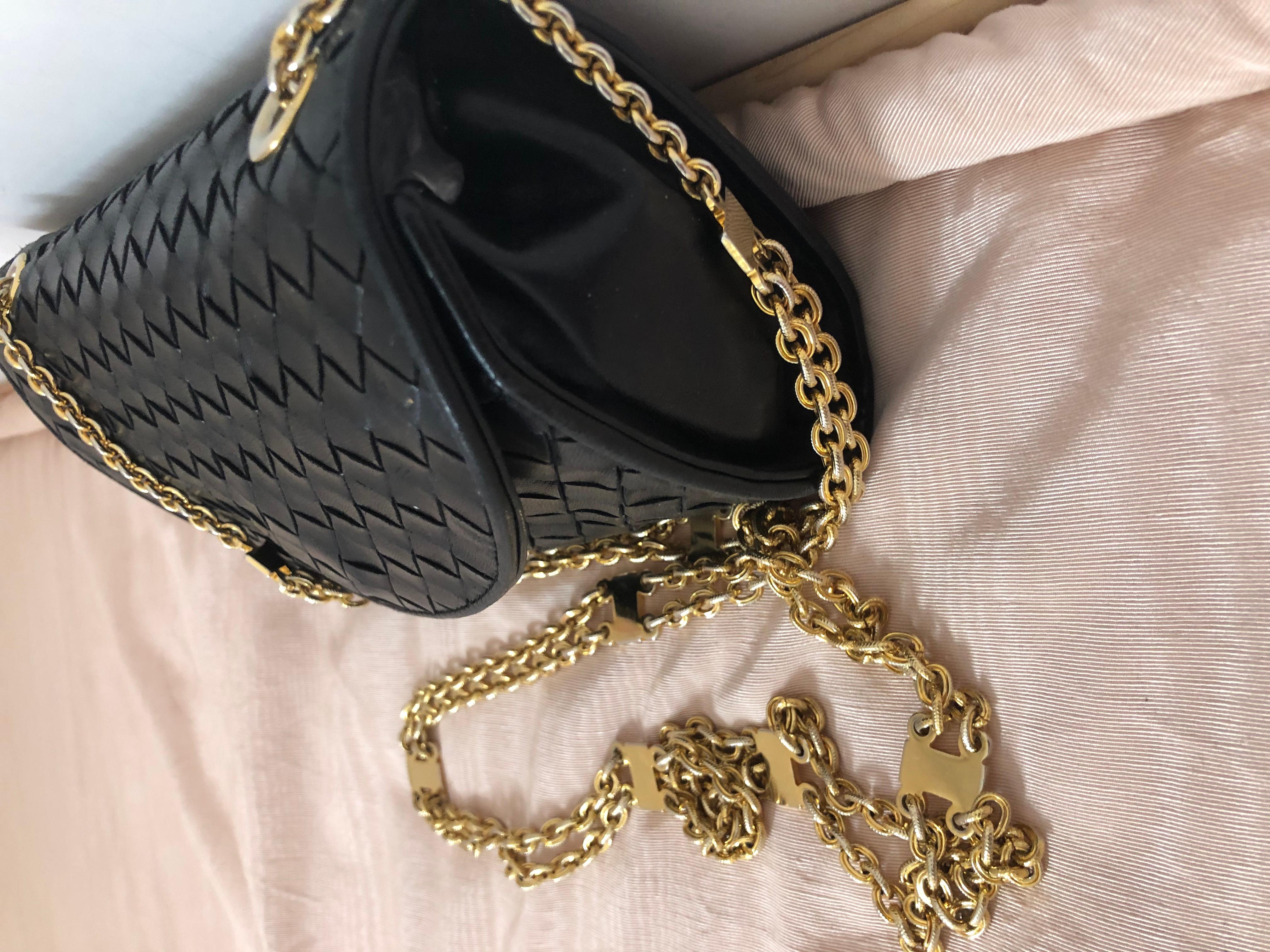 This beautifully crafted handbag will take you from morning to night, no need to change your purse. It is in excellent condition except for the lining (as pictured) which has started peeling in places. The leather is supple, the gold tone chain is