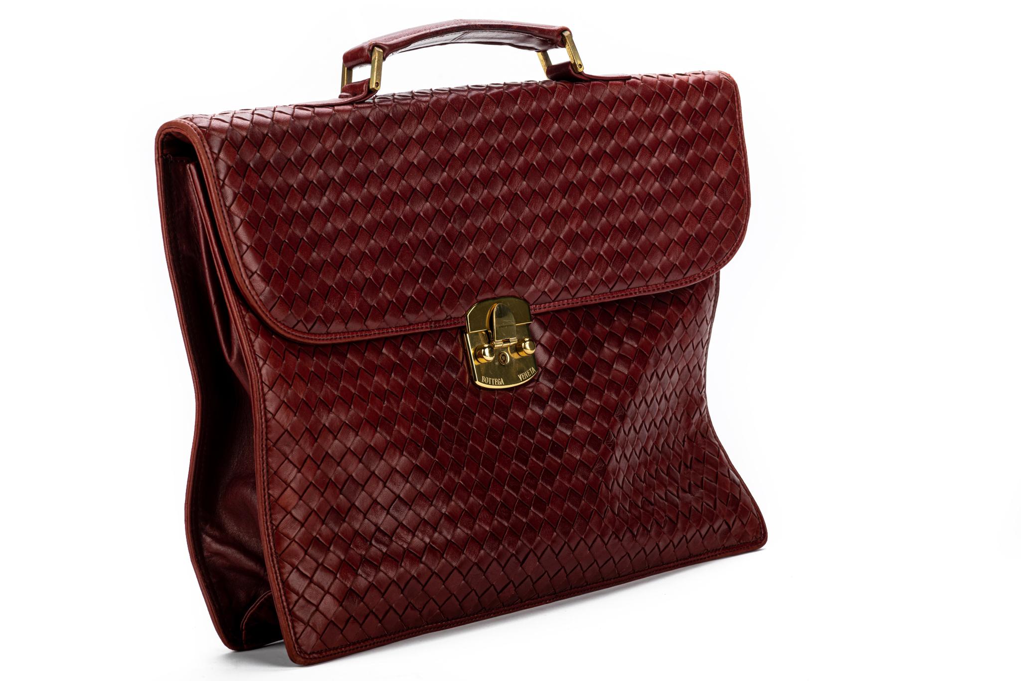 Buttery soft Vintage Bottega Veneta Intrecciato Burgundy Leather Briefcase. Condition is Pre-owned. Zipper works perfectly Brass hardware shows a little wear. Minor stains inside . Comes with original dust cover.