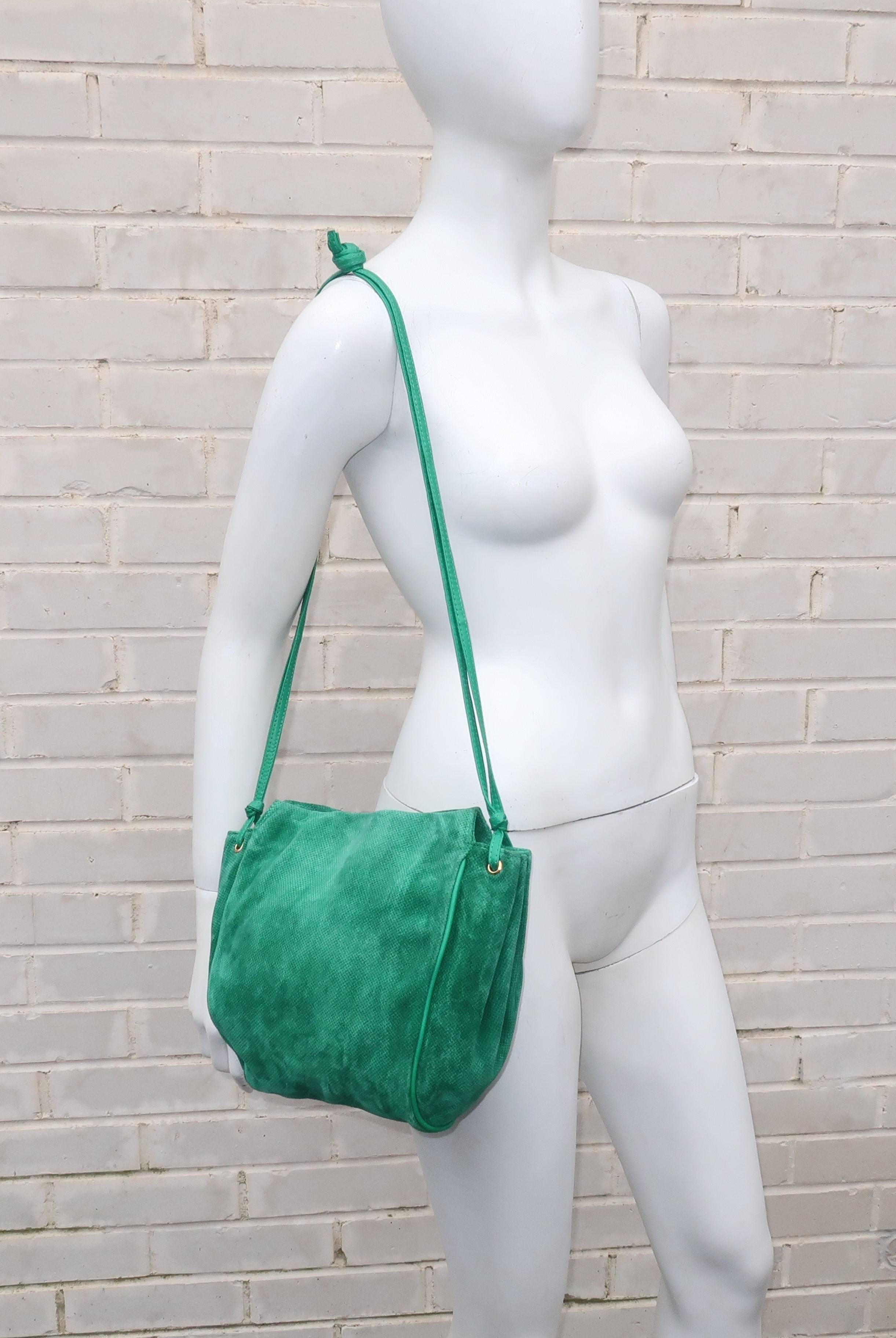 This vintage Bottega Veneta green suede handbag is a beautiful splash of color in a youthful hobo silhouette.  Bottega Veneta's slogan 'When your own initials are enough' is apropos as their handbags speak volumes about style and quality without the