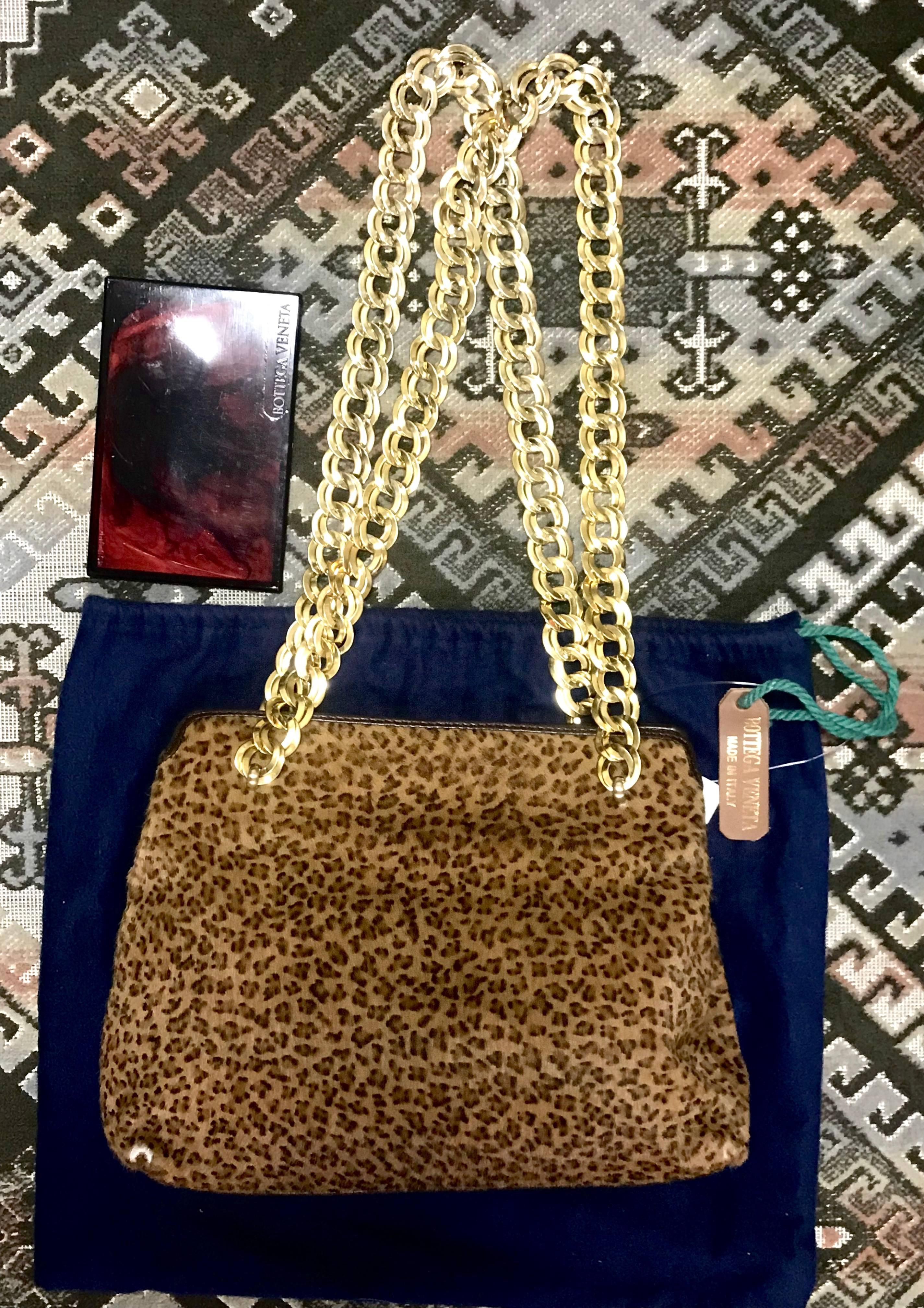 1990s. Vintage Bottega Veneta leopard printed genuine fur leather shoulder bag with double golden chain straps. Rare masterpiece from Bottega.

Introducing another vintage bag from Bottega Veneta from 90’s.
Made out of leopard printed short hair fur