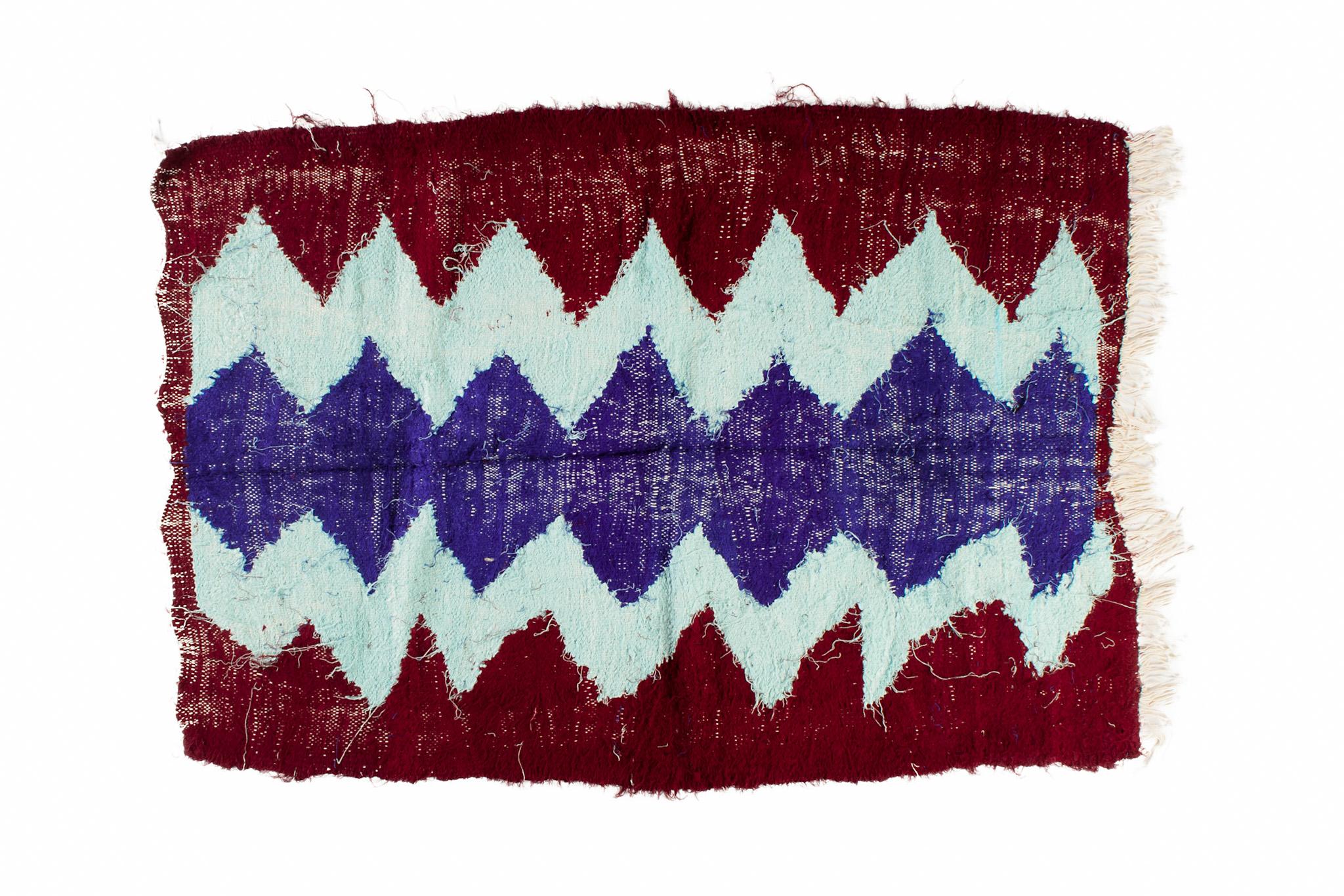 Boucharouite rugs are made of multicolored clothes pieces. This is the most authentic recycled rug you've ever seen! Measurements: 4.8'х3.3' / 149x101 cm.

Boucharouite – is the ancient manual technique of tying and interweaving the multicolored