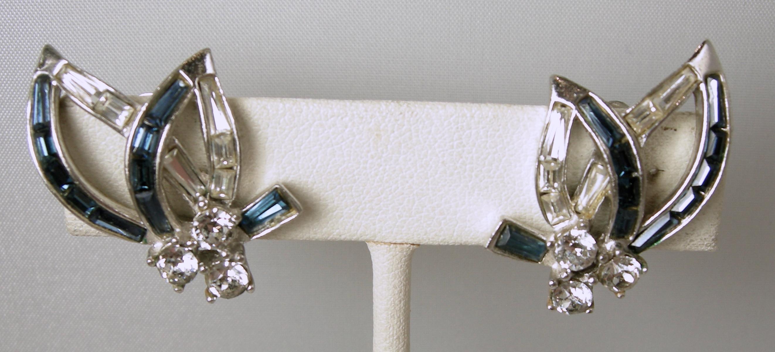 These earrings are unsigned Boucher earrings but it does have the Boucher style number “5280”. They have blue and clear crystals in a rhodium silver tone setting. These clip earrings measure 1-1/4” x 7/8” and are in excellent condition.