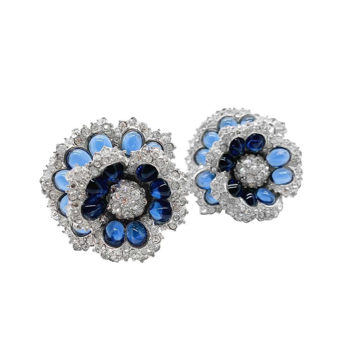 Exquisite vintage Boucher flower earrings. Featuring tiers set with cabochon sapphire crystal and edging in pave set chatons. A fabulous high quality piece as you would expect from Boucher jewellery. Jewels by Marcel Boucher are without doubt,