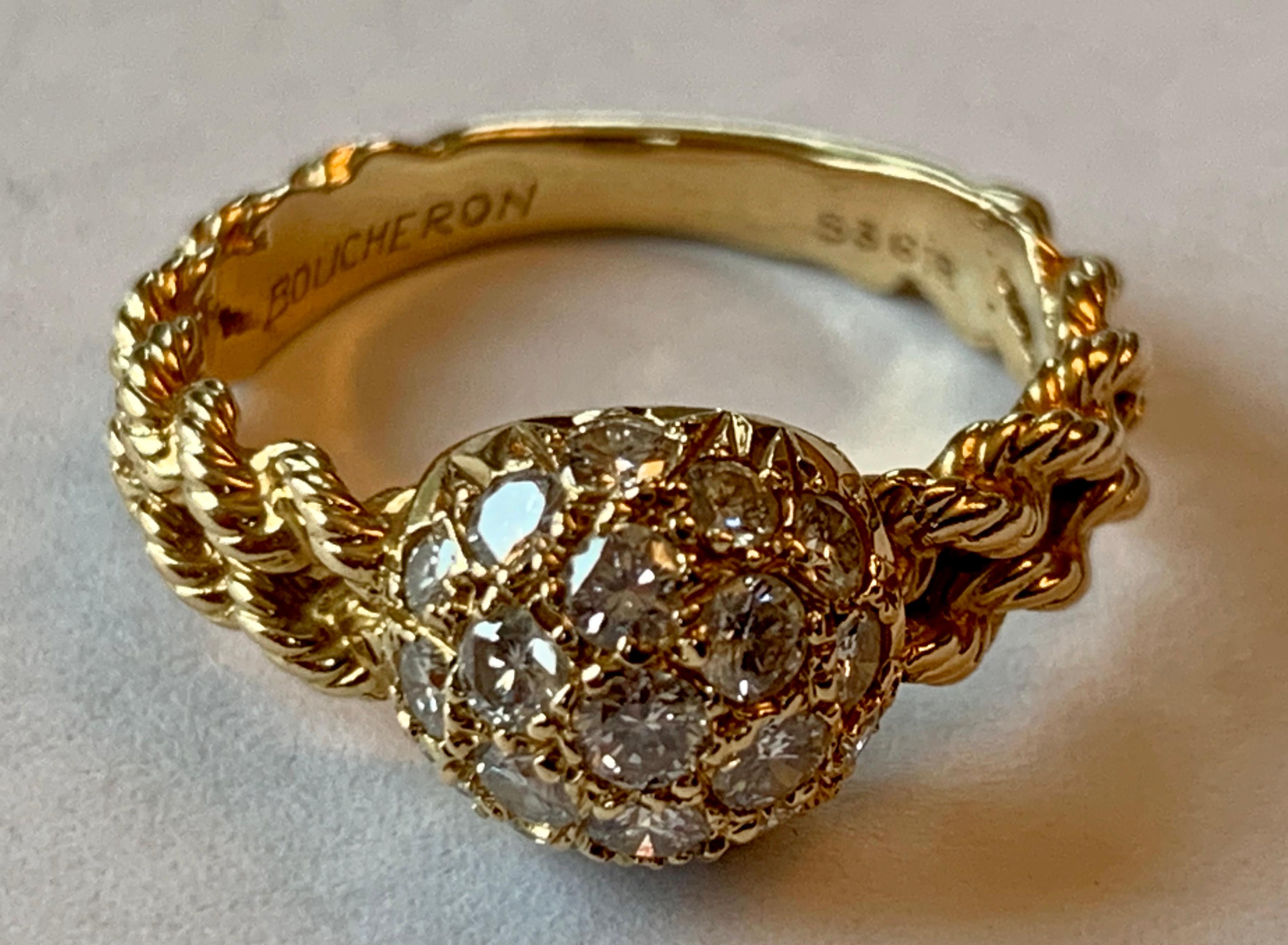 This is an 18 K yellow Gold fancy scroll pattern ring with pavé set Diamond s from the designer Boucheron.