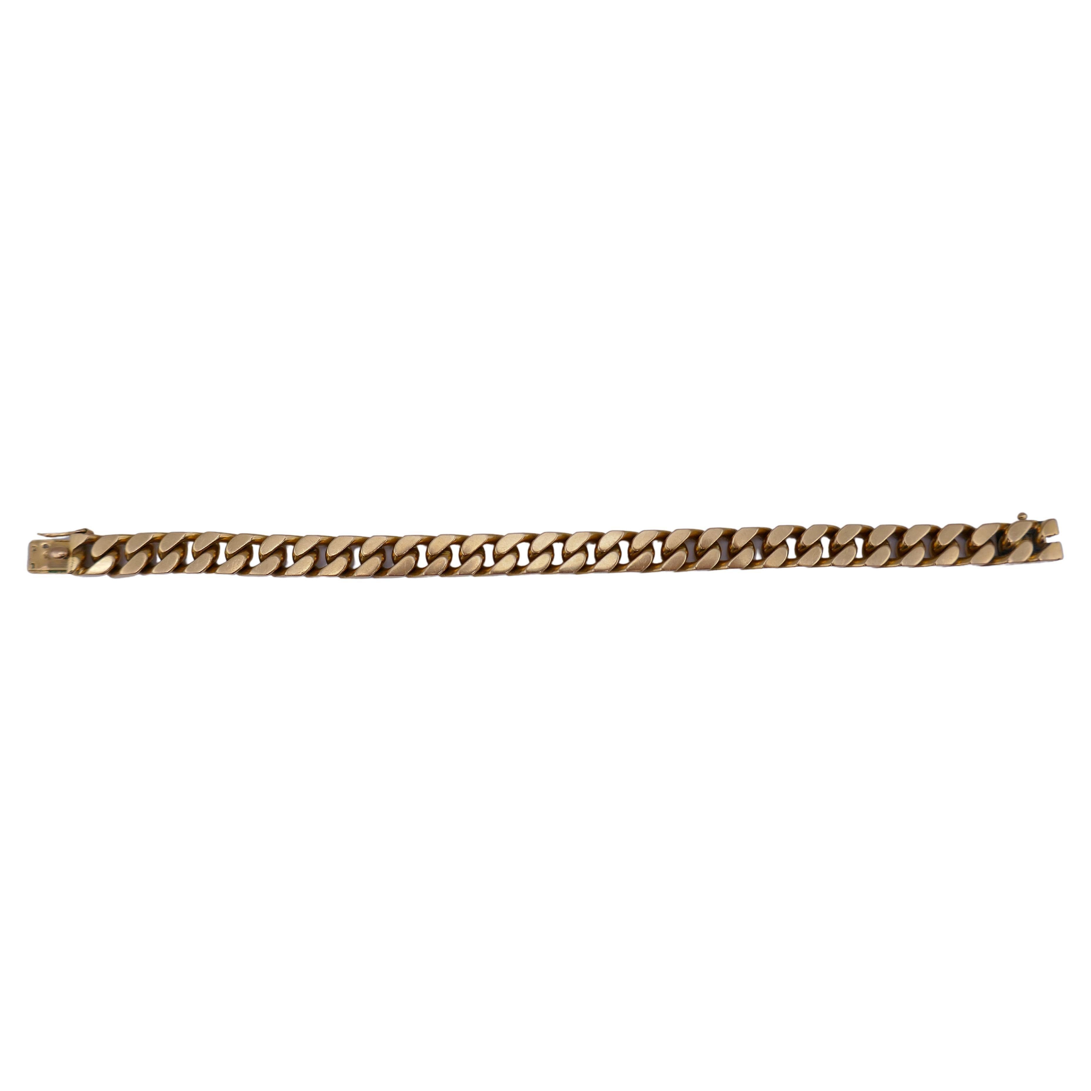 A perfect gold curb link chain bracelet by Boucheron. 
The bracelet is made of 18k gold and has a great color. Thick yet flat, this gold chain bracelet is great for wearing solo or as a part of a stack. 
The clasp stamped with Boucheron maker's