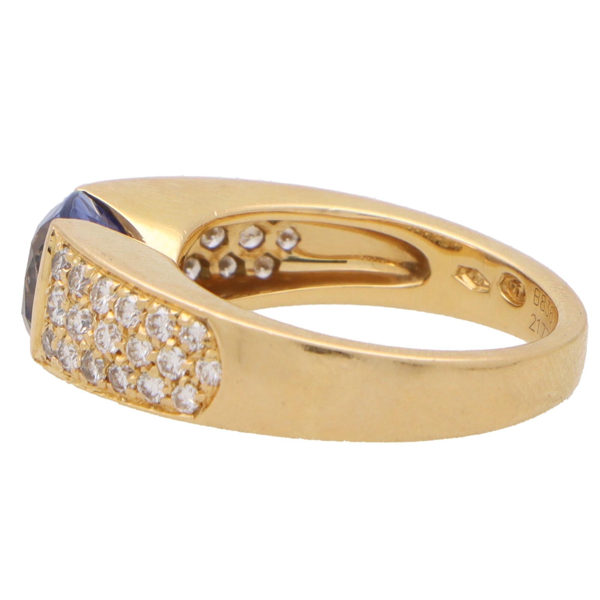 A beautiful vintage Boucheron sapphire and diamond ring set in 18k yellow gold.

The ring is designed in a slightly raised bombé design and is centrally set with a bezel-set cushion cut blue sapphire. To either side of the sapphire are raised bombé