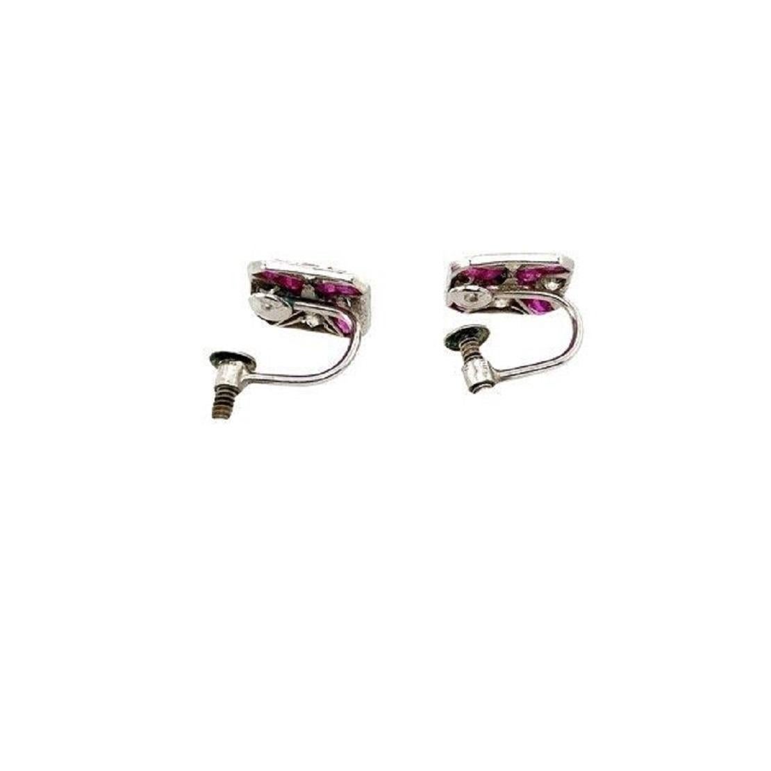 These vintage ruby earrings are beautiful. Set in platinum and 9ct white gold screws, with 0.25ct diamonds and 0.65ct rubies.

Additional Information:
Total Weight: 2.5g
Earrings Dimension: 9.65mm
Total Diamond Weight: 0.25ct
Diamond Clarity:
