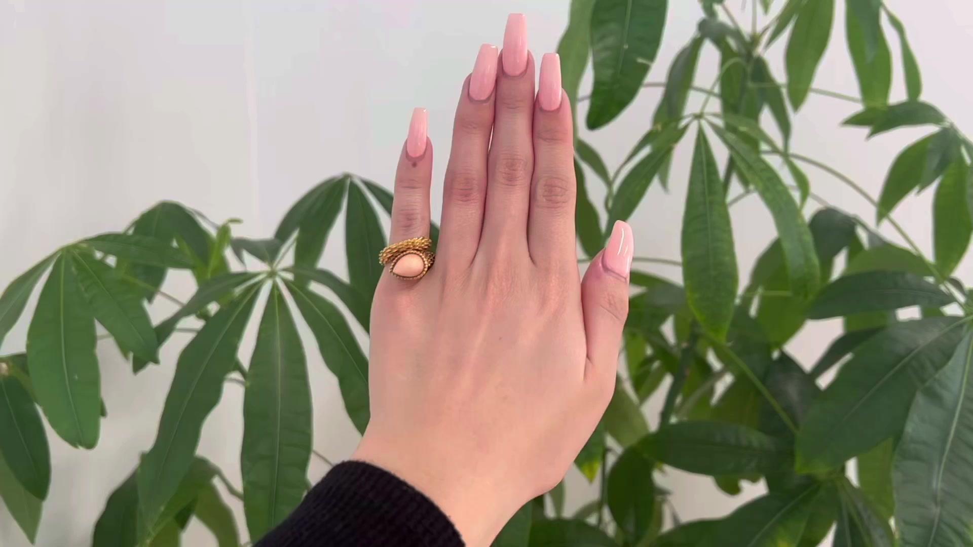 One Vintage Boucheron French Coral 18k Yellow Gold Serpent Boheme Ring. Featuring one cabochon cut coral. Crafted in 18 karat yellow gold signed Boucheron with French hallmarks. Circa 1970. The ring is a size 2 3/4.

About this Item: No collection