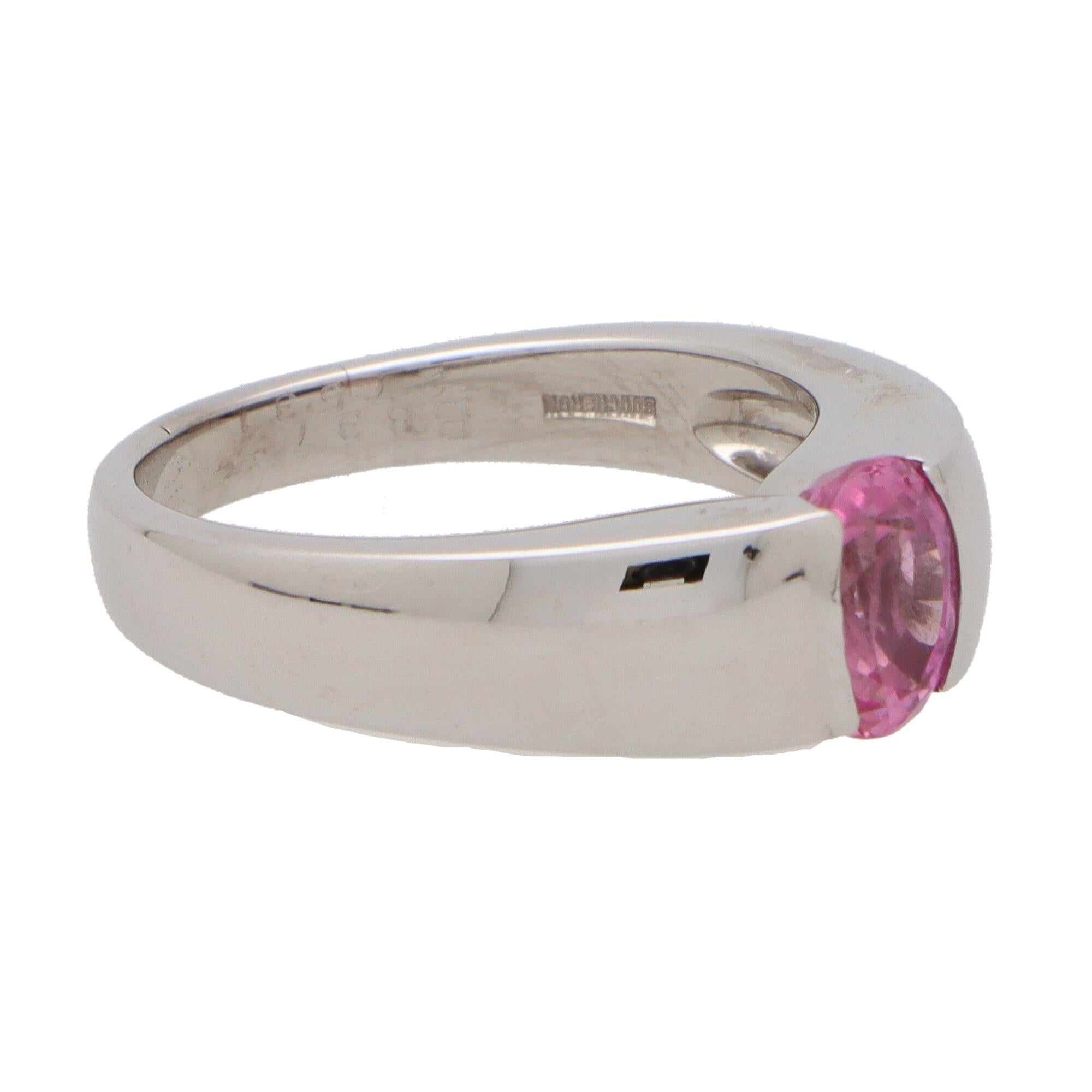 A beautiful vintage Boucheron pink sapphire ring set in 18k white gold.

The ring is solely set with a vibrant oval cut pink sapphire stone which is bezel set securely within a raised white gold mounting.

The design of the ring is simple yet