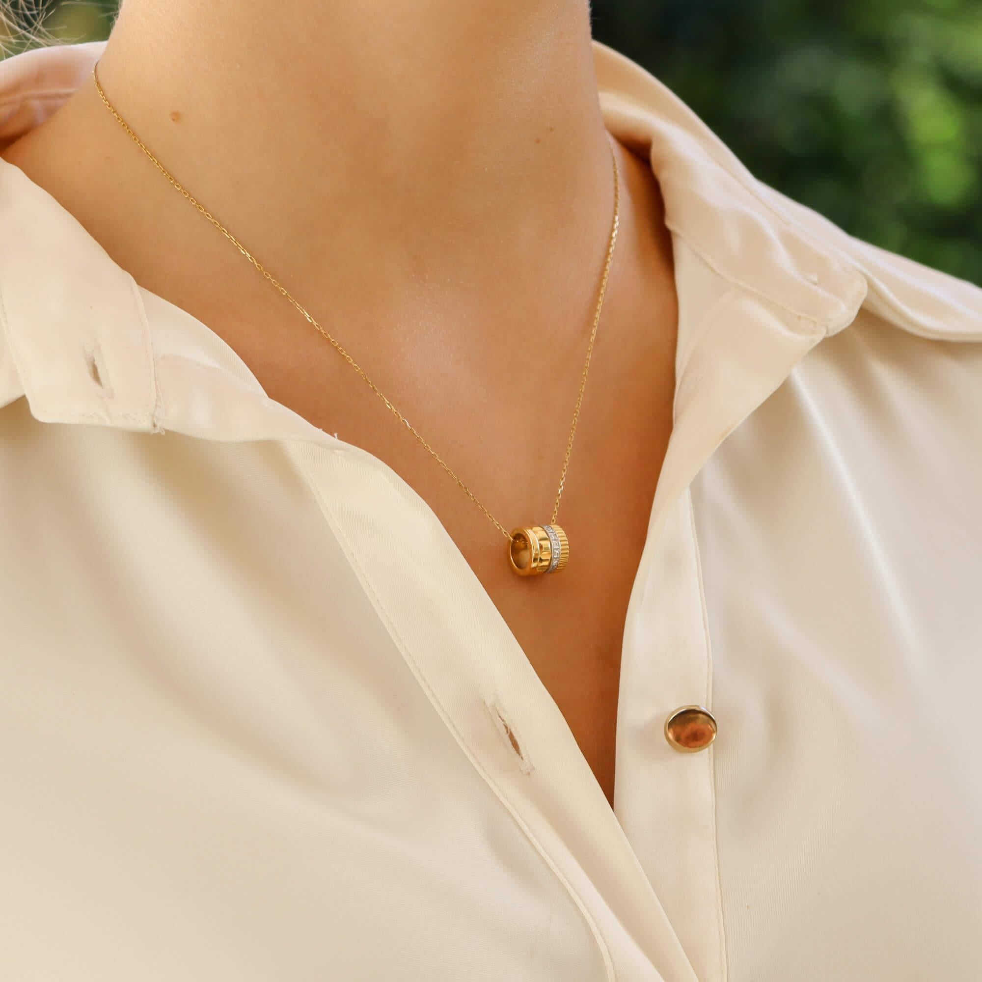 A stylish vintage Boucheron ‘Quatre Classique’ pendant necklace set in 18k yellow gold.

The pendant is a discontinued design in the current Boucheron Quarte Classique collection. This is the largest model and consists of four panels to signify the