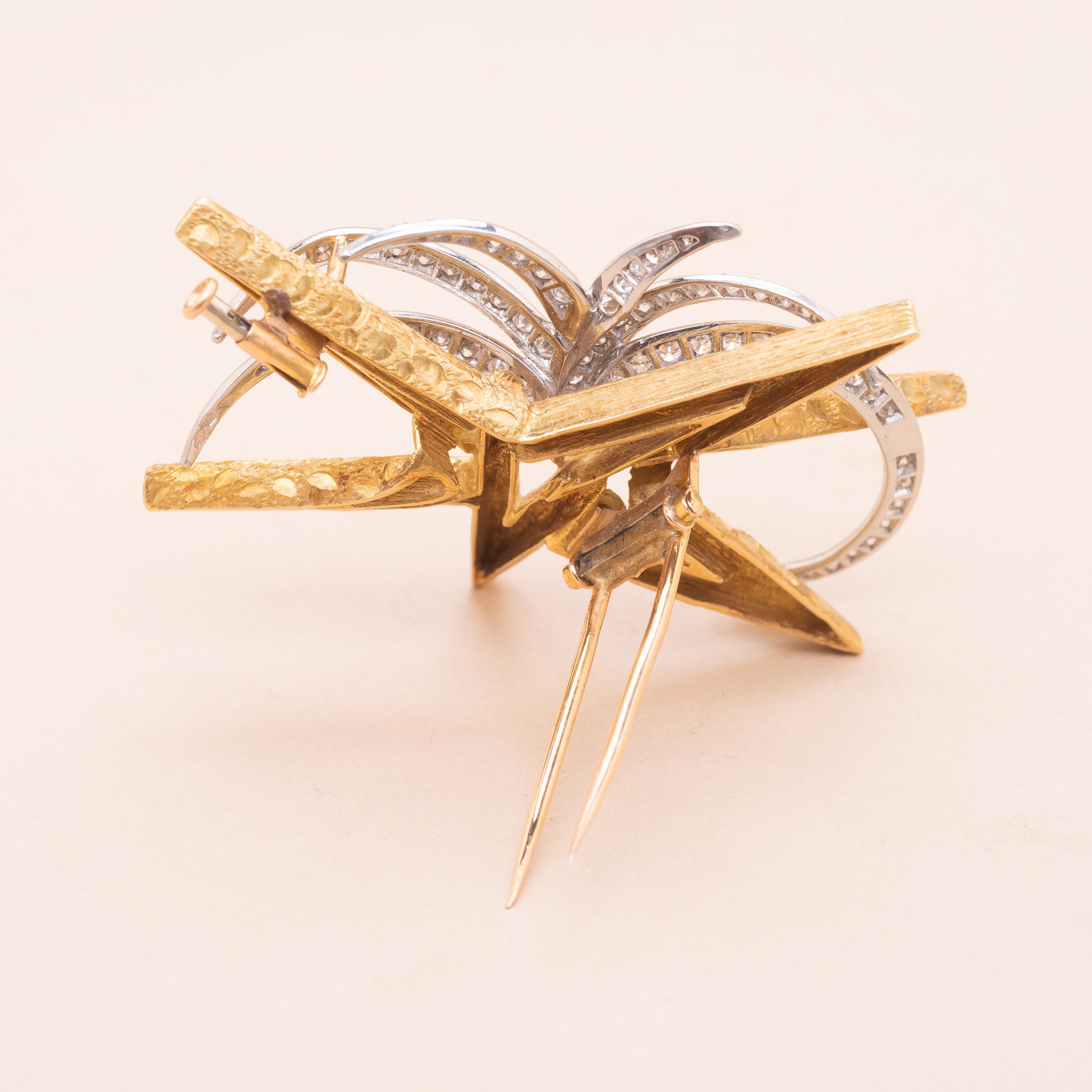 Boucheron. Vintage 18K gold and platinum star brooch. Made of  brushed and engraved gold triangles and lines set with round modern brillant and 8/8 cut diamonds.  

Gorgeous creation from the fifties 

Signed on the back Boucheron Paris

Number