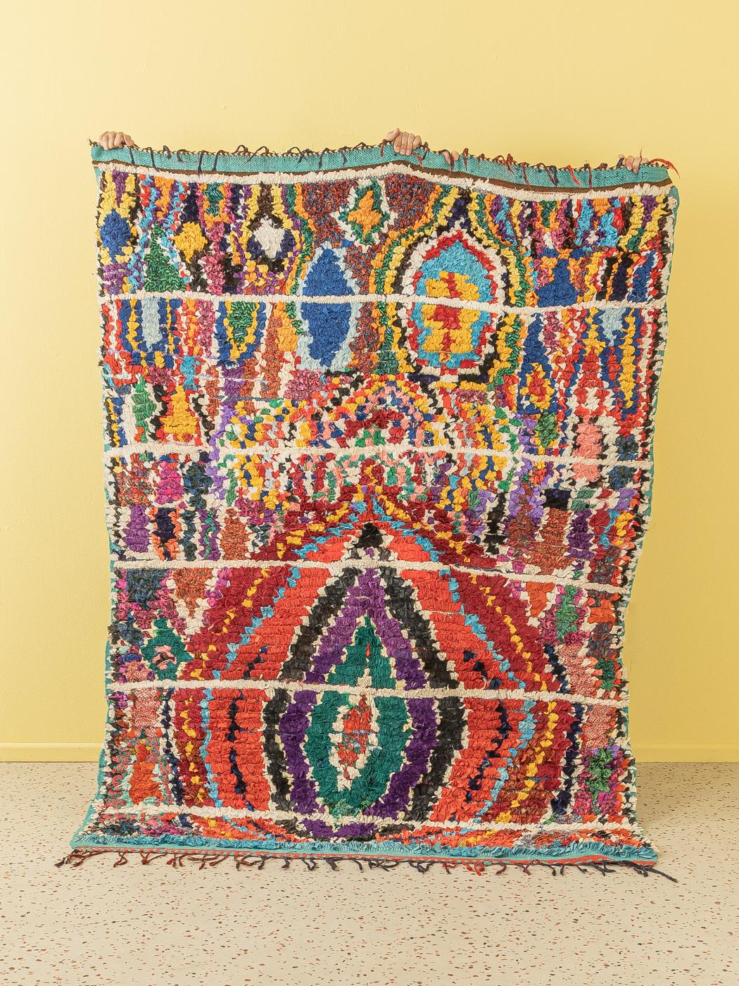 This Boucherouite is an upcycled vintage Berber rug that includes old fabrics and clothes – thick and soft, comfortable underfoot. Our Berber rugs are handmade, one knot at a time. Each of our Berber rugs is a long-lasting one-of-a-kind piece,
