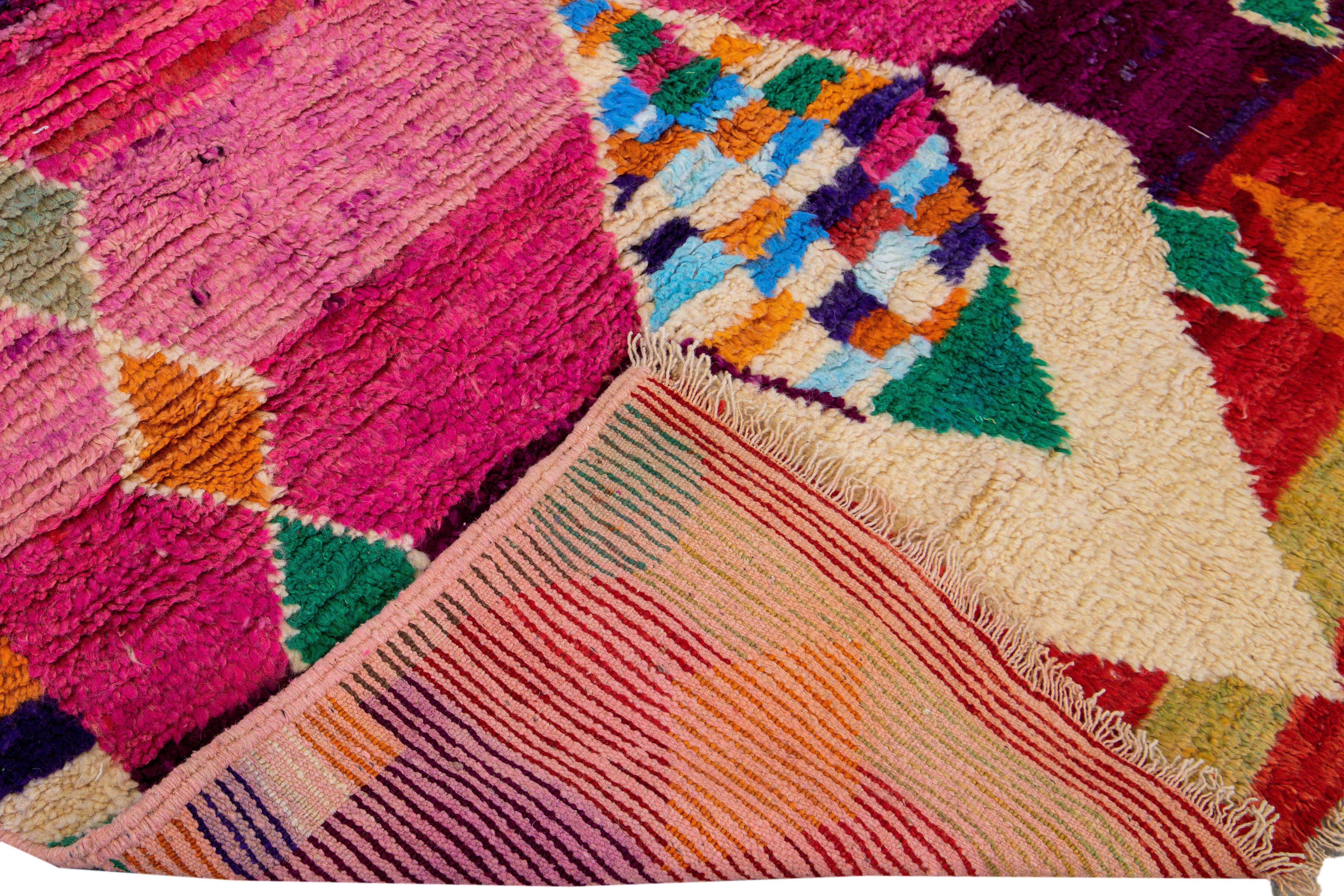 Beautiful Vintage Boujad Moroccan handmade wool rug with the purple and bright multi-color field in all-over geometric Bohemian design.

 This rug measures: 5'9